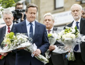 Prime Minister David Cameron and Labour Party leader Jeremy Corbyn lay flowers while Shadow foreign secretary Hilary Benn and Commons Speaker John Bercow look on in Birstall, West Yorkshire, after Labour MP Jo Cox was shot and stabbed to death in the street outside her constituency advice surgery. PRESS ASSOCIATION Photo. Picture date: Friday June 17, 2016. Mrs Cox, the mother of two children, aged three and five, was attacked by a man reportedly shouting "Britain first" at lunchtime on Thursday. See PA story POLICE MP. Photo credit should read: Danny Lawson/PA Wire