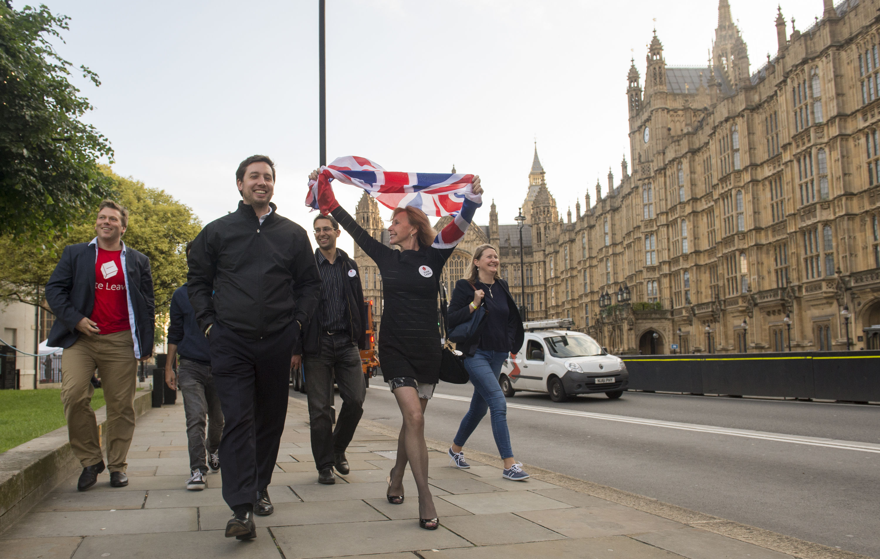 Leave supporters celebrate opposite the Houses of Parliament.