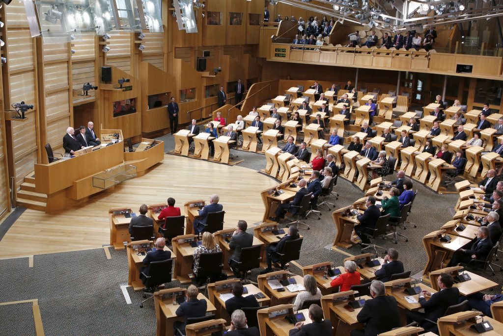 Irish president Michael D Higgins (standing at left) addresses MSPs in the main chamber of the Scottish Parliament in Edinburgh on the third day of his official visit to Scotland. PRESS ASSOCIATION Photo. Picture date: Wednesday June 29, 2016. See PA story POLITICS Higgins. Photo credit should read: Jane Barlow/PA Wire