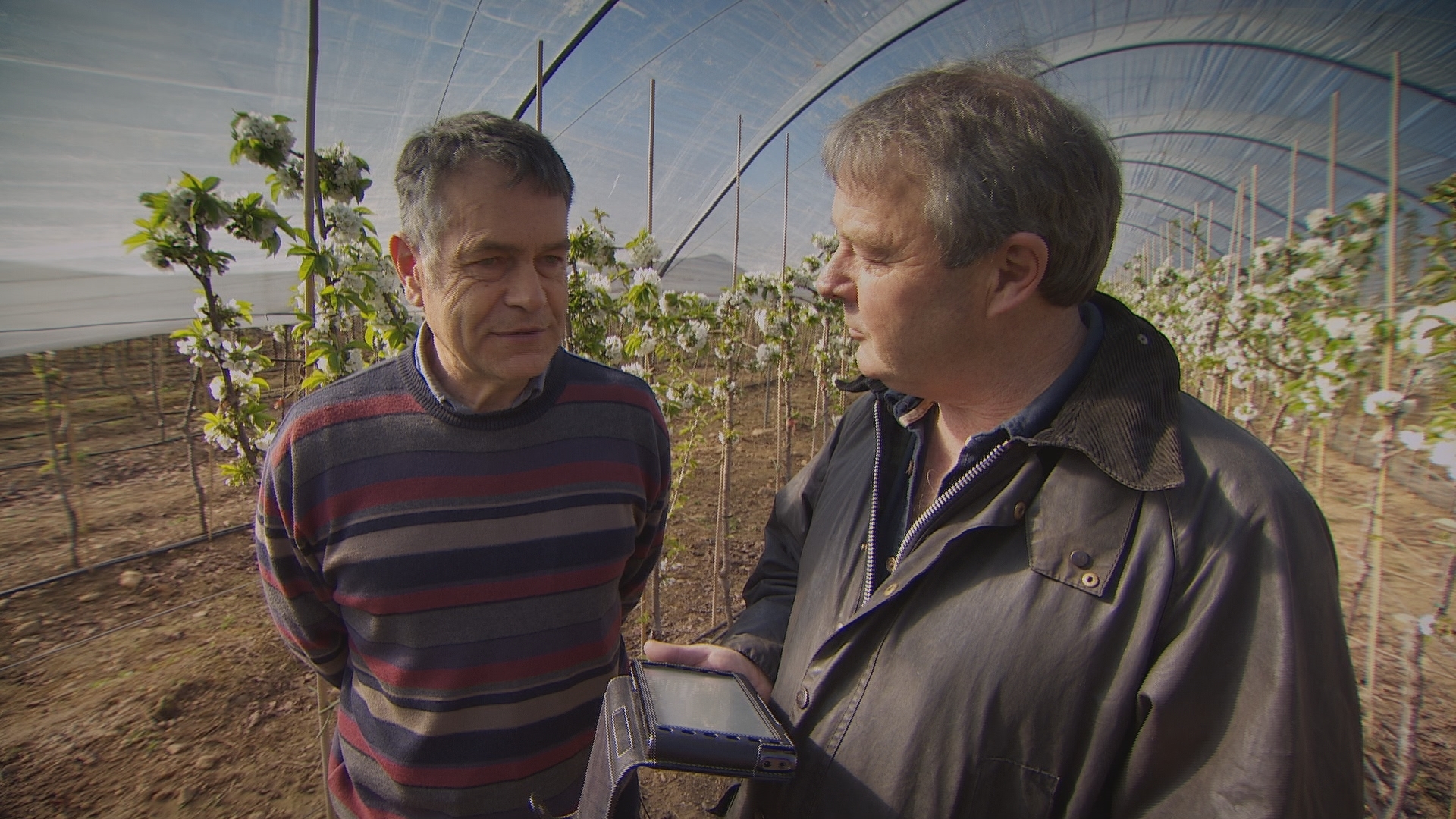 Farmer Peter Thomson, left, interviewed by Landward presenter Euan McIlwraith.