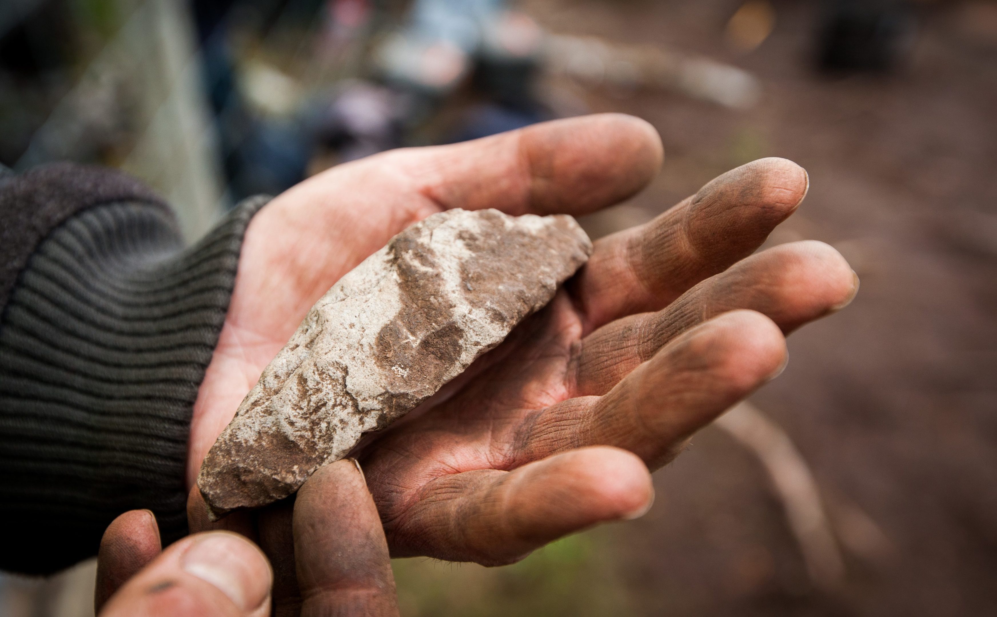 Dr Oliver O'Grady with a hard stone not belonging to that area, that was shaped for a purpose.