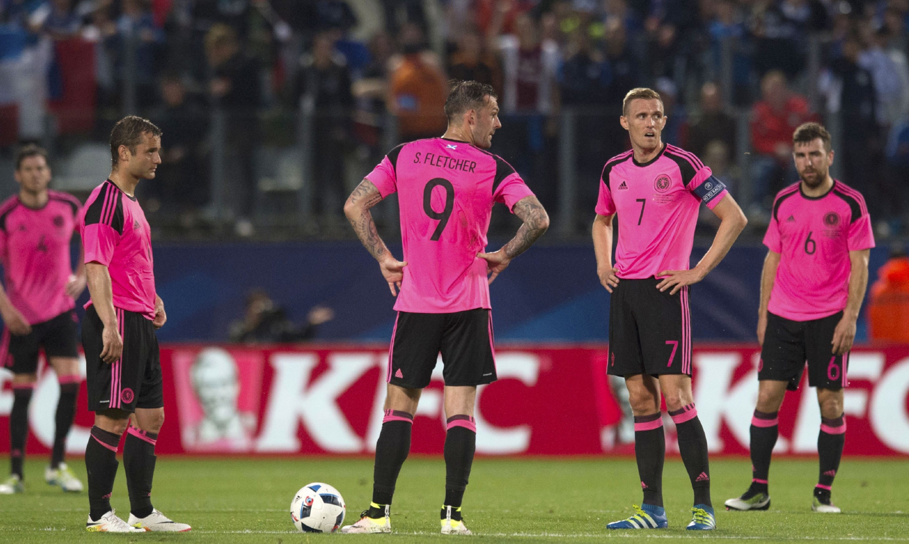 The Scots players look dejected after conceding a second goal to the French.