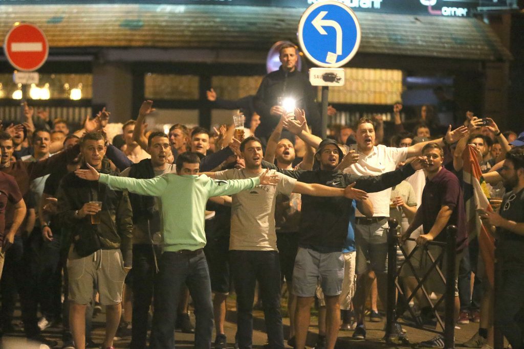 England fans chant in Lille city centre, France, as fresh clashes have taken place between England fans and Russian hooligans at Euro 2016. PRESS ASSOCIATION Photo. Picture date: Wednesday June 15, 2016. Video posted online showed Russian hooligans approaching a group of English and Welsh fans as they drank together. See PA story SPORT Euro2016. Photo credit should read: Niall Carson/PA Wire