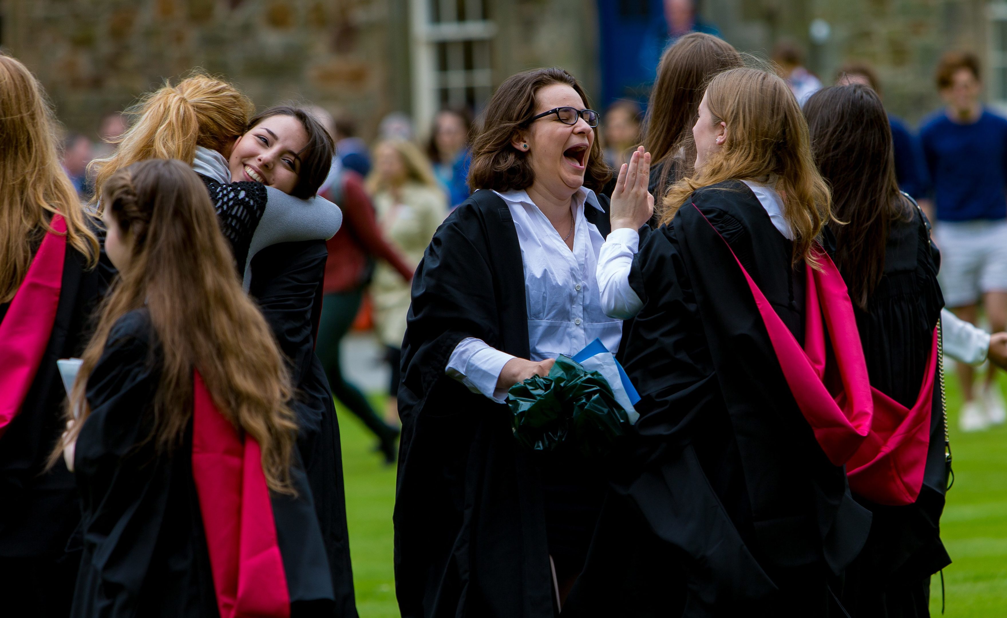 Students celebrate in St Salvators Quadrangle.