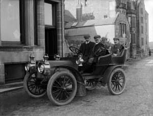 Four gentlemen golfers in a Car, St Andrews, 1904. By John Fairweather, held in Cowie Collection.