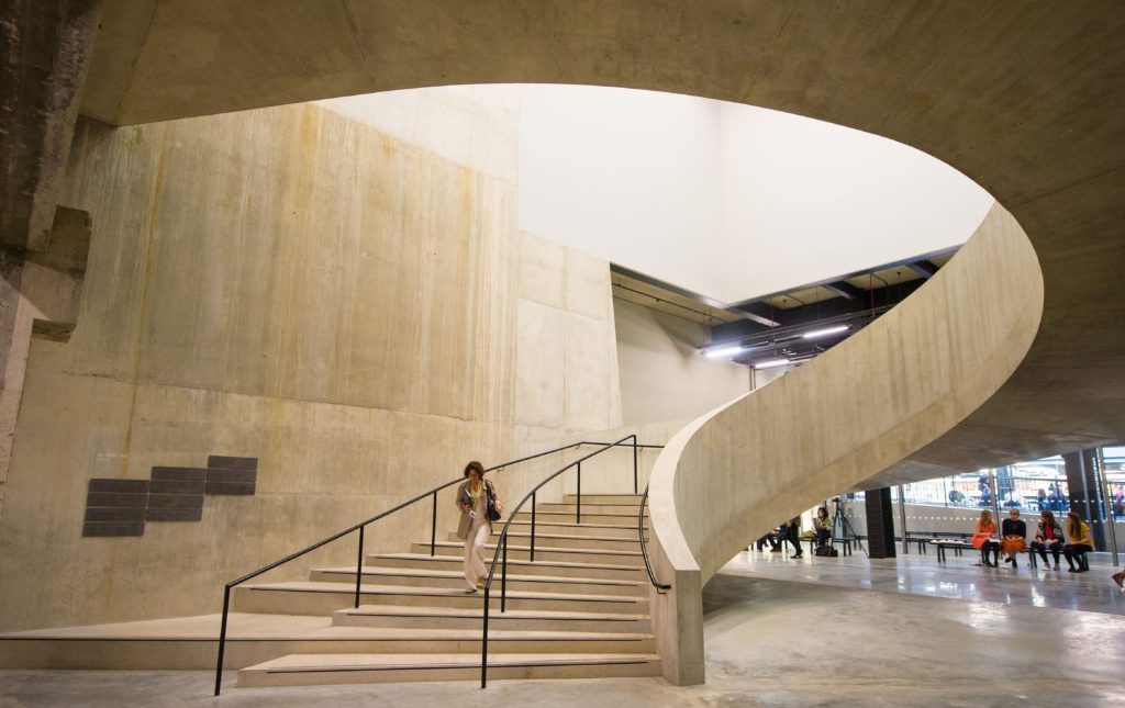 Visitor walking down a staircase in the new Switch House.