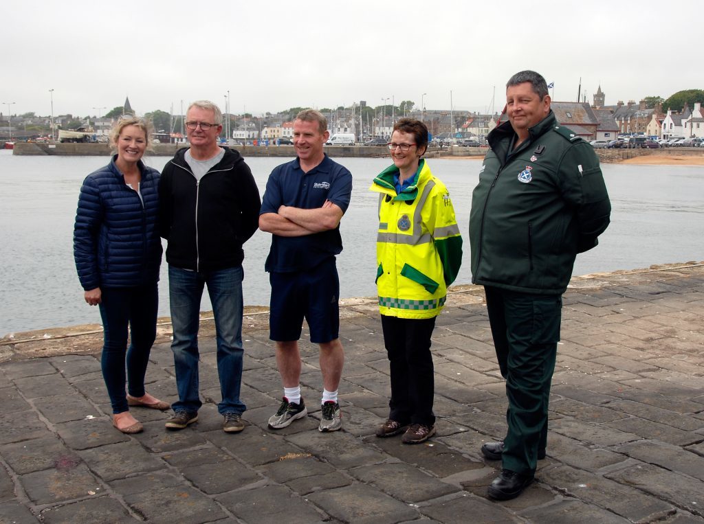 Pictured from left) Fiona Clarke Brians wife), Brian Clarke, Stuart Barton, Gillian Easson First Responder) and Ian Wilson paramedic St Andrews Station.