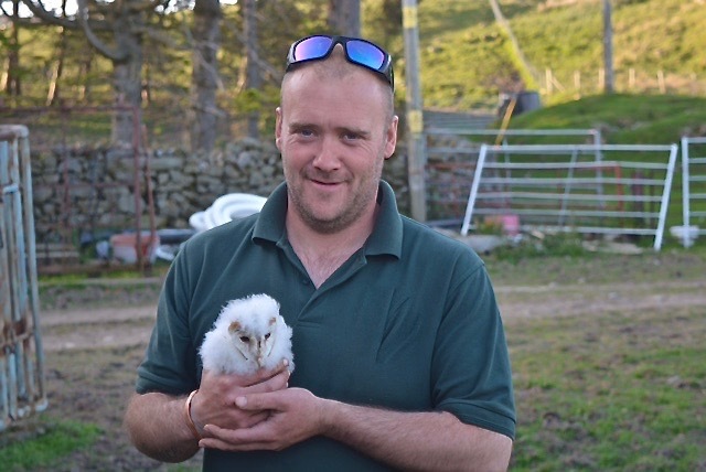 Gamekeeper Sean Reddington with one of the ringed barn owl chicks nesting on the Angus grouse estate.