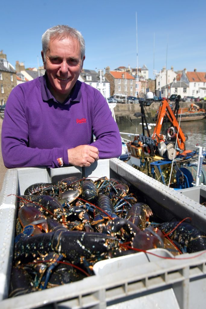Tom Mackenzie with freshly landed shellfish at Pittenweem Harbour