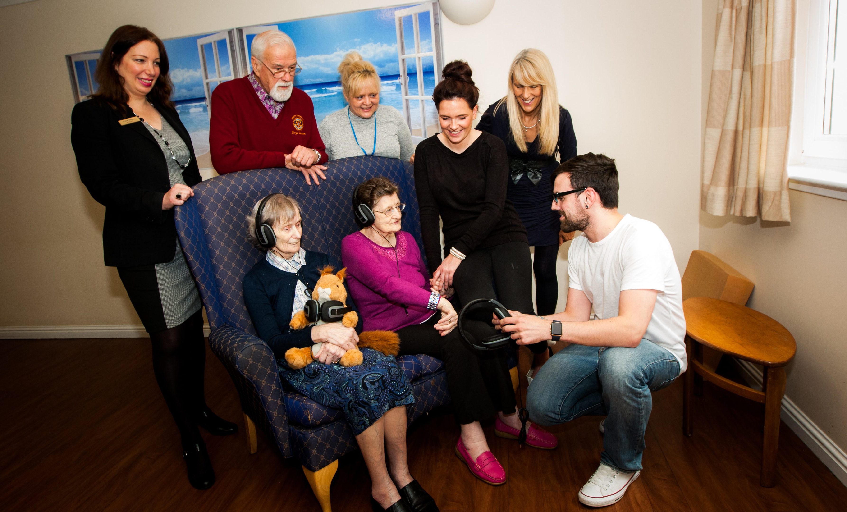 Connecting older people with memories via music. Pictured, at the front left to right is resident Cecilia alongside resident Alice, Jade Matthew (Activities Coordinator at Care Home), Carolyn Wilson (Fall Service Manager, NHS Tayside) and student Jeff Grant (NQ Computing Technology student). Back row, left to right is Fiona Whyte (Manager at Care Home), George Cameron (Perth Kinnoull Rotary) and Julie Parker (Social Work).