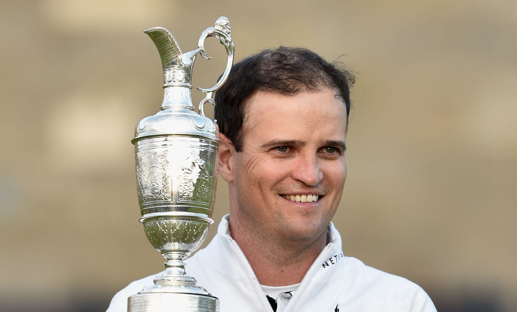 US golfer Zach Johnson holds the Claret Jug after winning the 144th Open Championship at The Old Course last year.