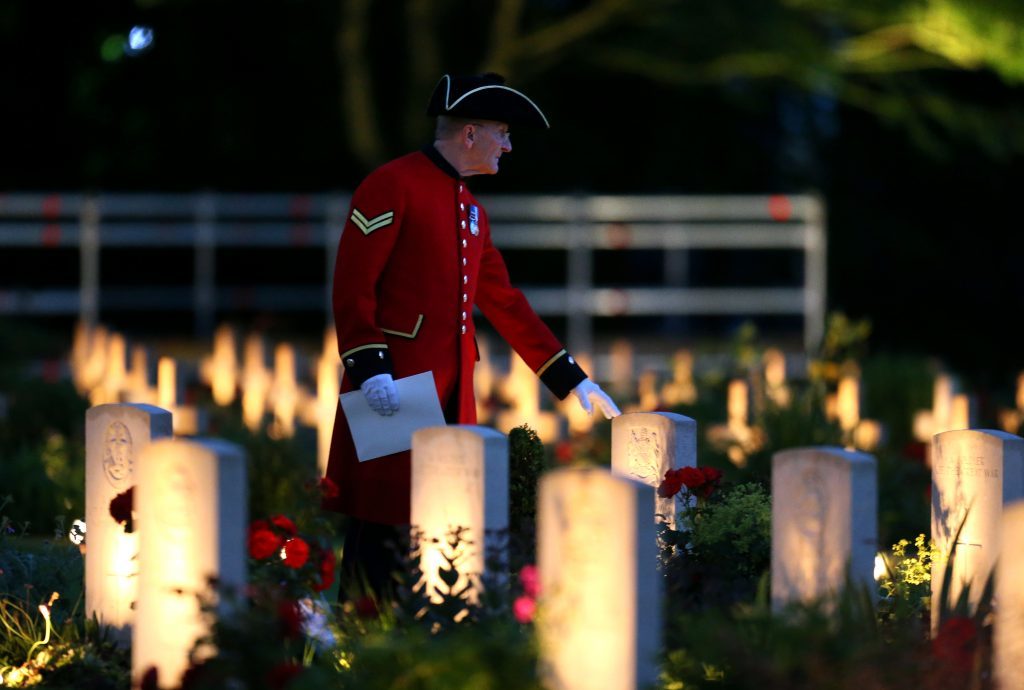 THIEPVAL, FRANCE - JUNE 30: A Chelsea Pensioner stands amongst the war graves during a military-led vigil to commemorate the 100th anniversary of the beginning of the Battle of the Somme at the Thiepval memorial to the Missing on June 30, 2016 in Thiepval, France. The event is part of the Commemoration of the Centenary of the Battle of the Somme at the Commonwealth War Graves Commission Thiepval Memorial in Thiepval, France, where 70,000 British and Commonwealth soldiers with no known grave are commemorated. (Chris Radburn - Pool/Getty Images)