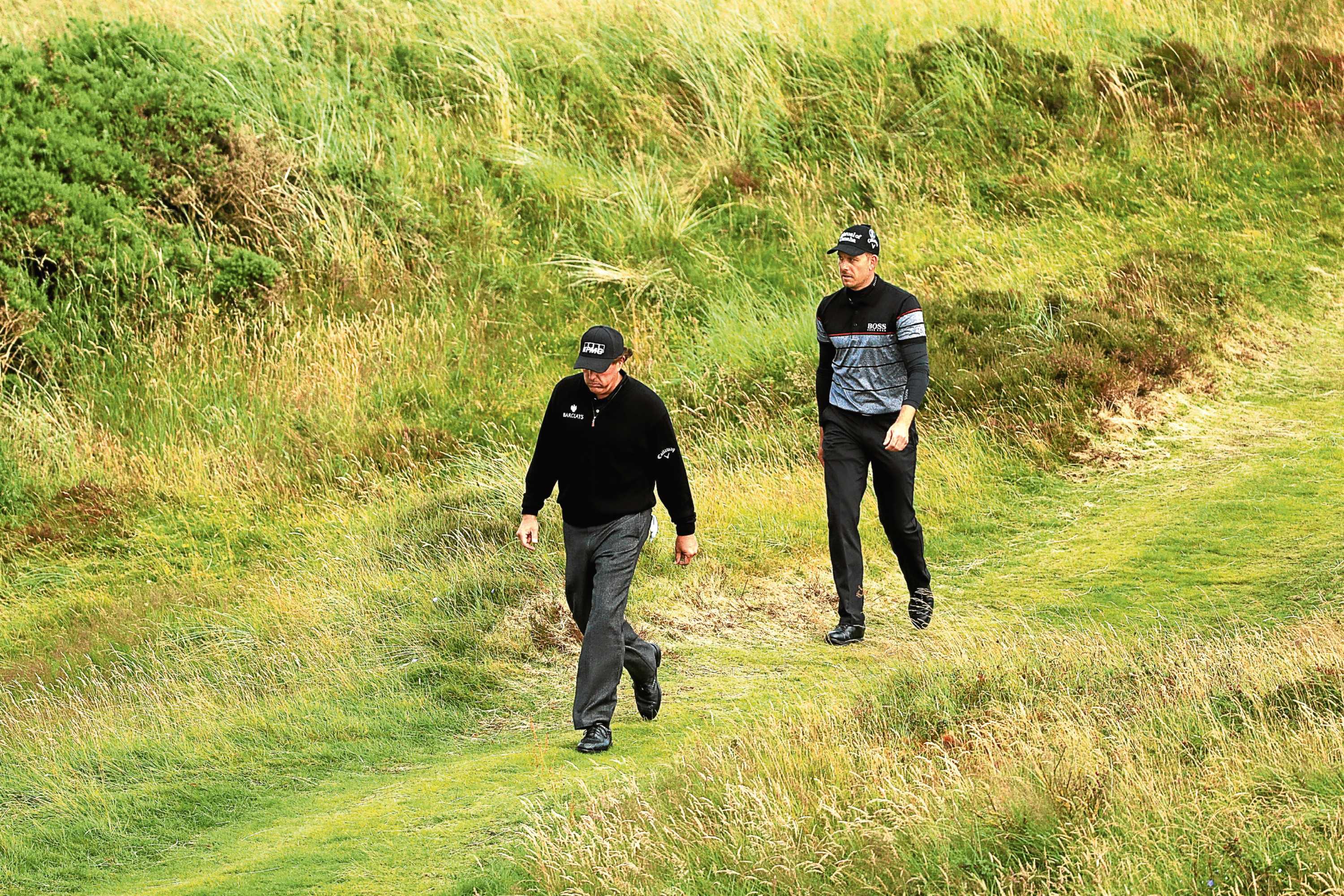 Phil Mickelson and Henrik Stenson during their duel in the dunes at Royal Troon.