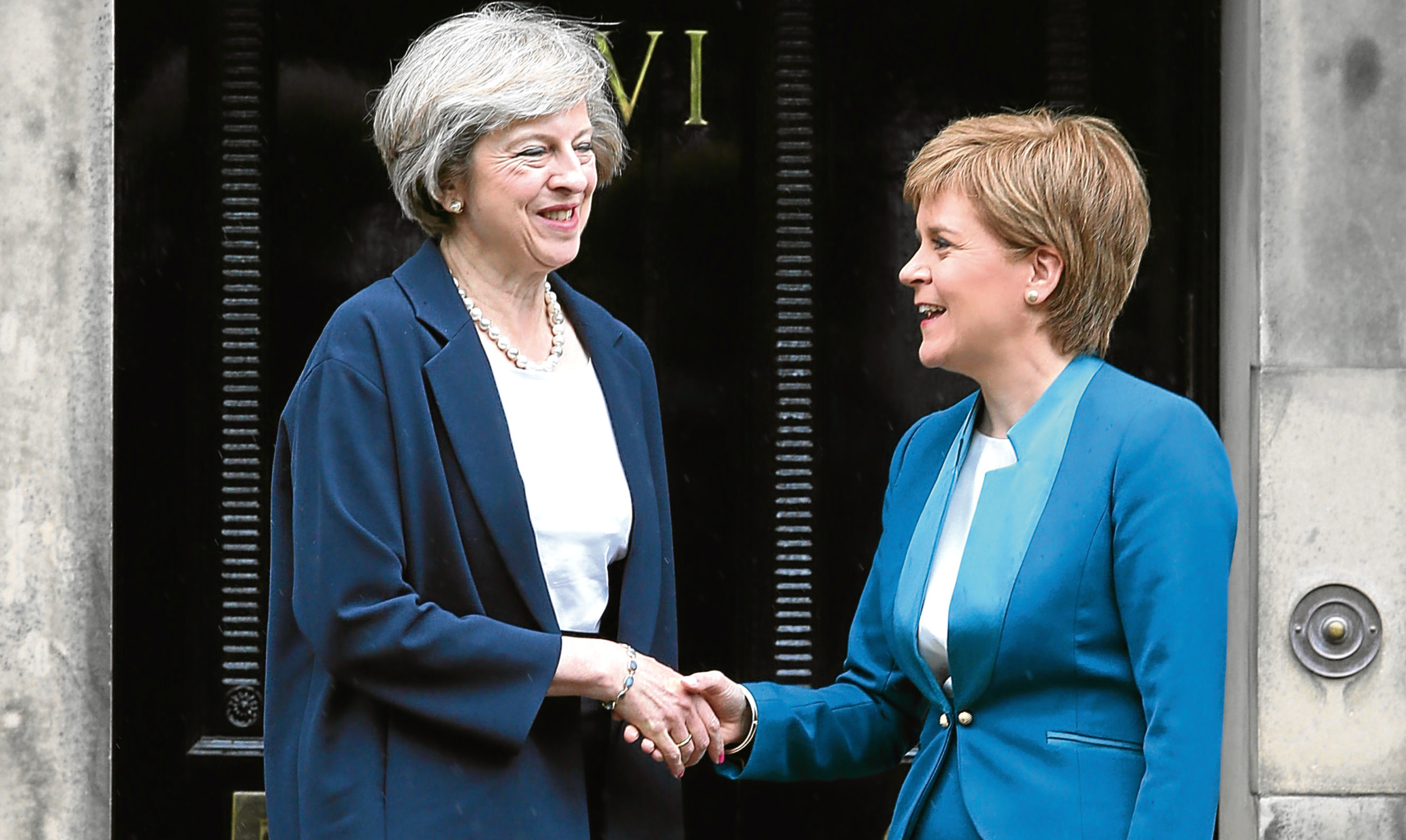 Theresa May greeted by Nicola Sturgeon outside Bute House in July.