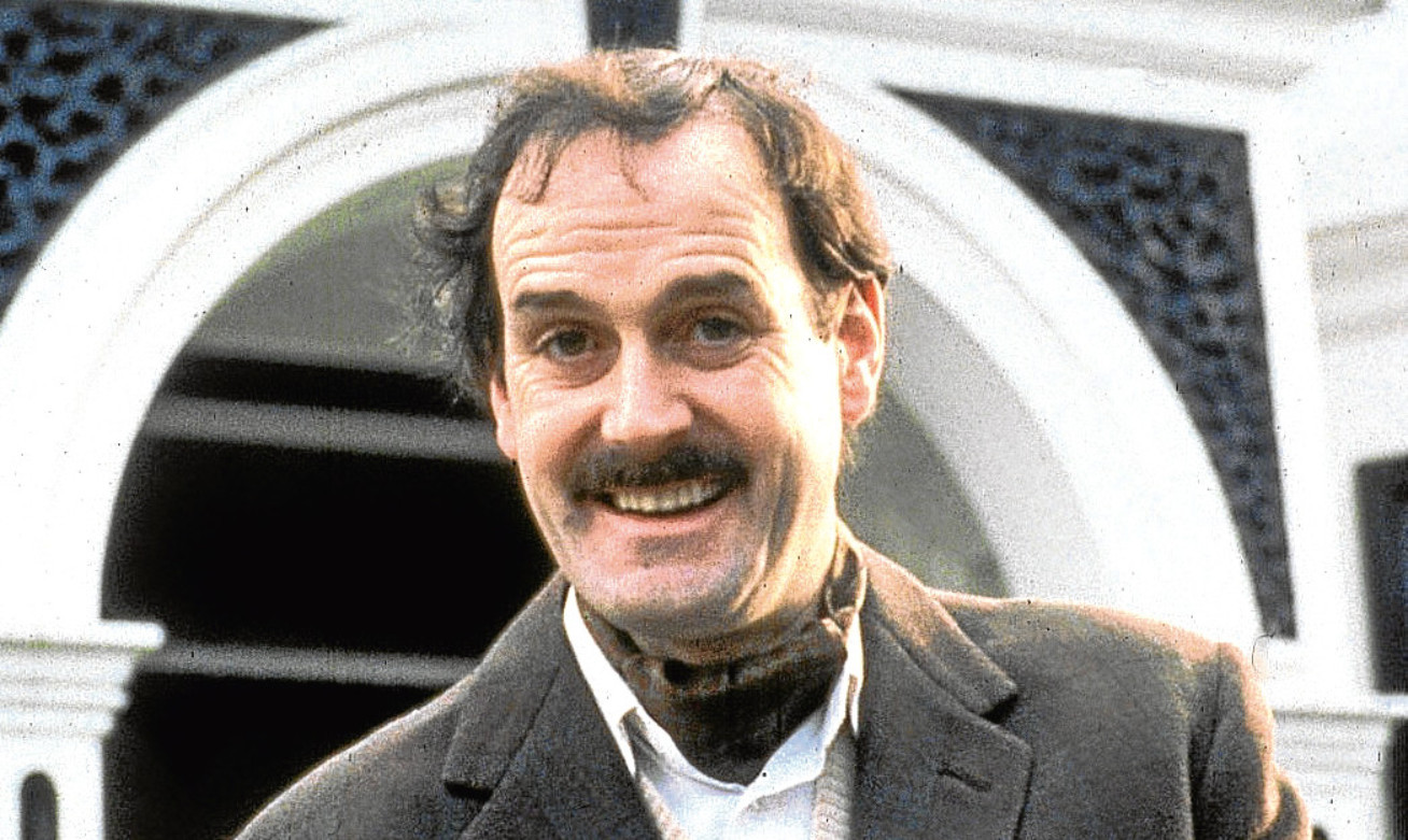 John Cleese as Basil Fawlty.