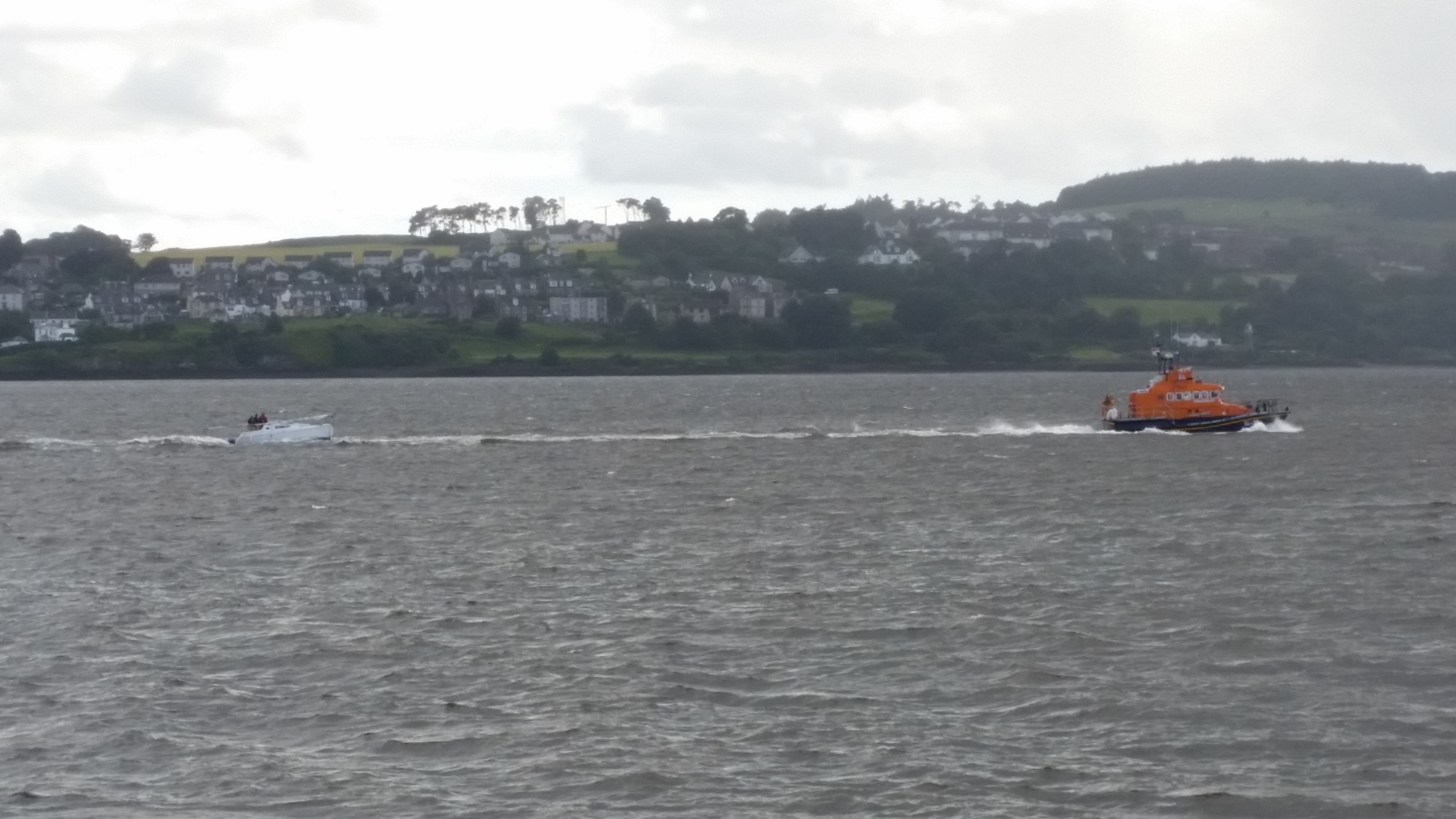 The all-weather lifeboat from Broughty Ferry towing the stricken yacht.