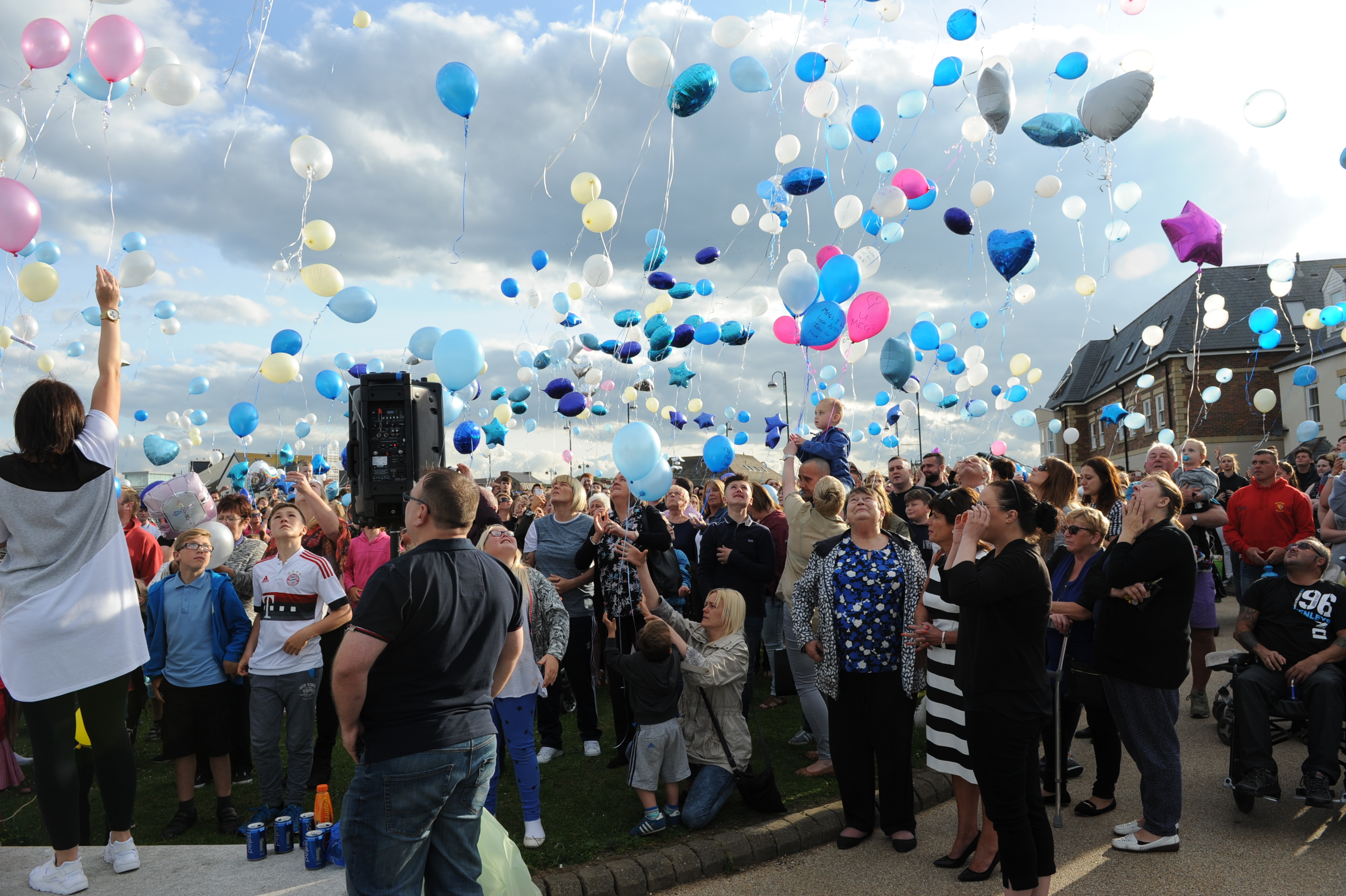 Hundreds of people release balloons at the vigil for Megan Bell.