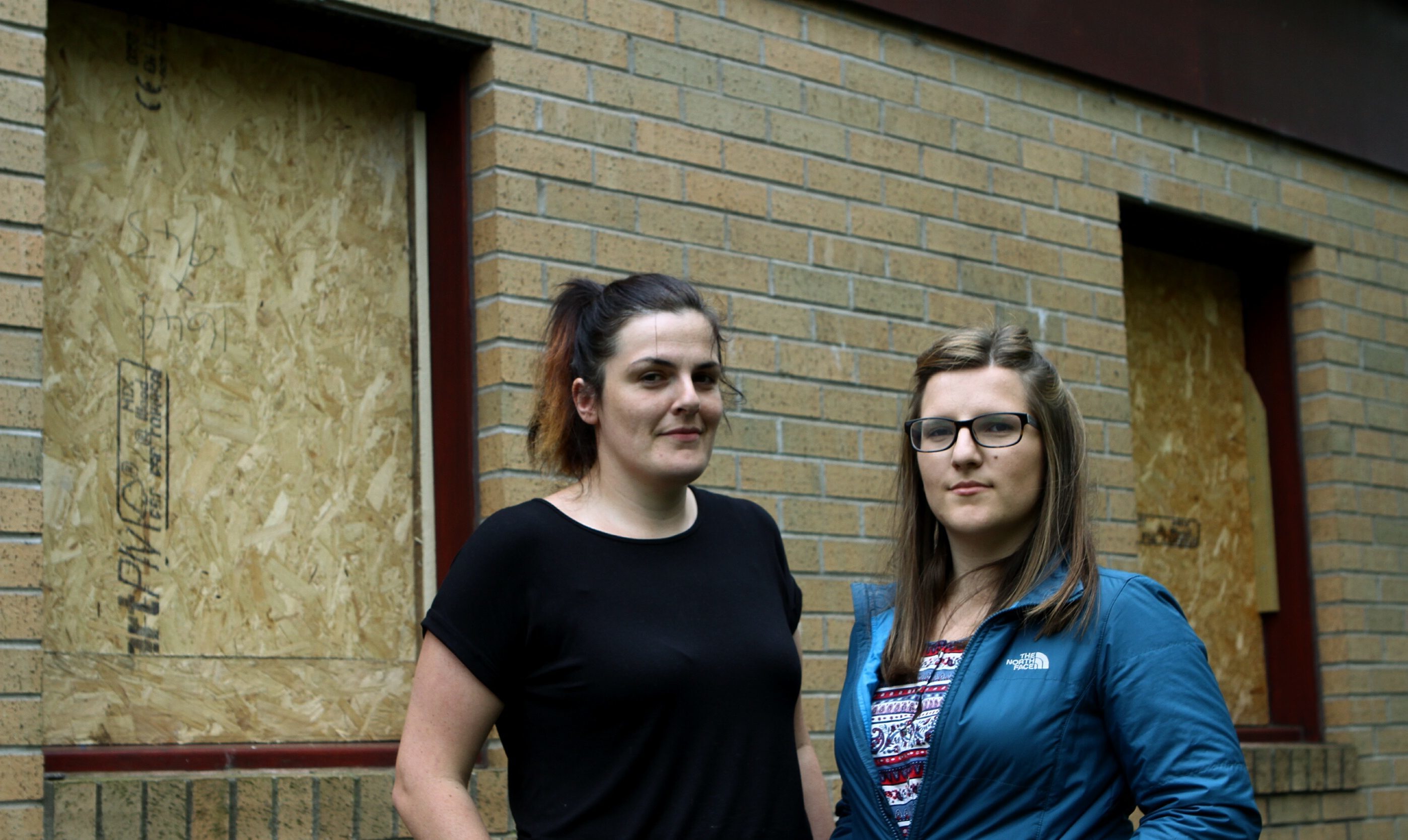 Rachel Stewart, right,   and Kelly Bennett of Angus Solidarity For Refugees, showing the broken windows.