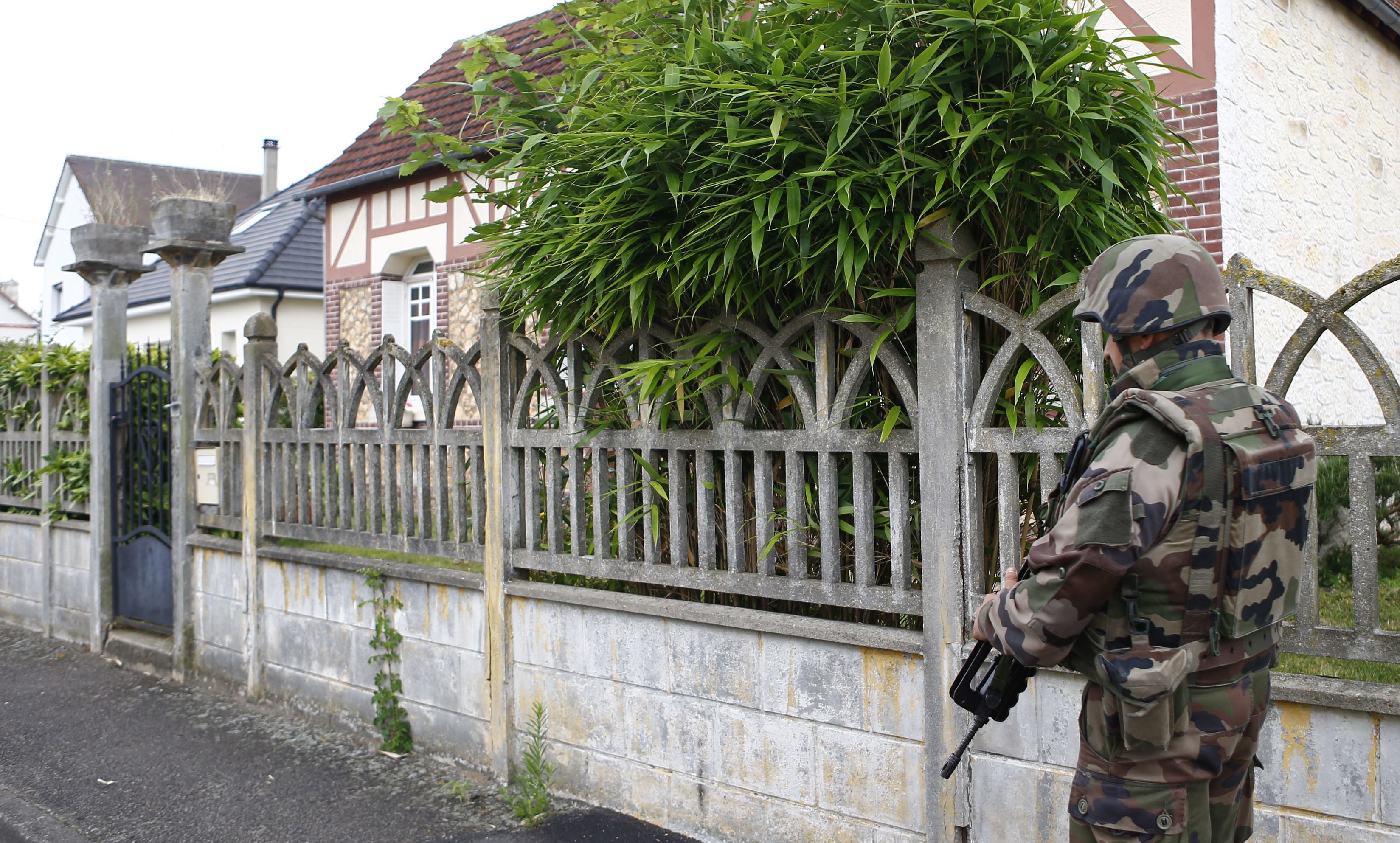 A French soldiers stands guard near the scene of the church terror attack in Saint-Etienne-du-Rouvray, Normandy.