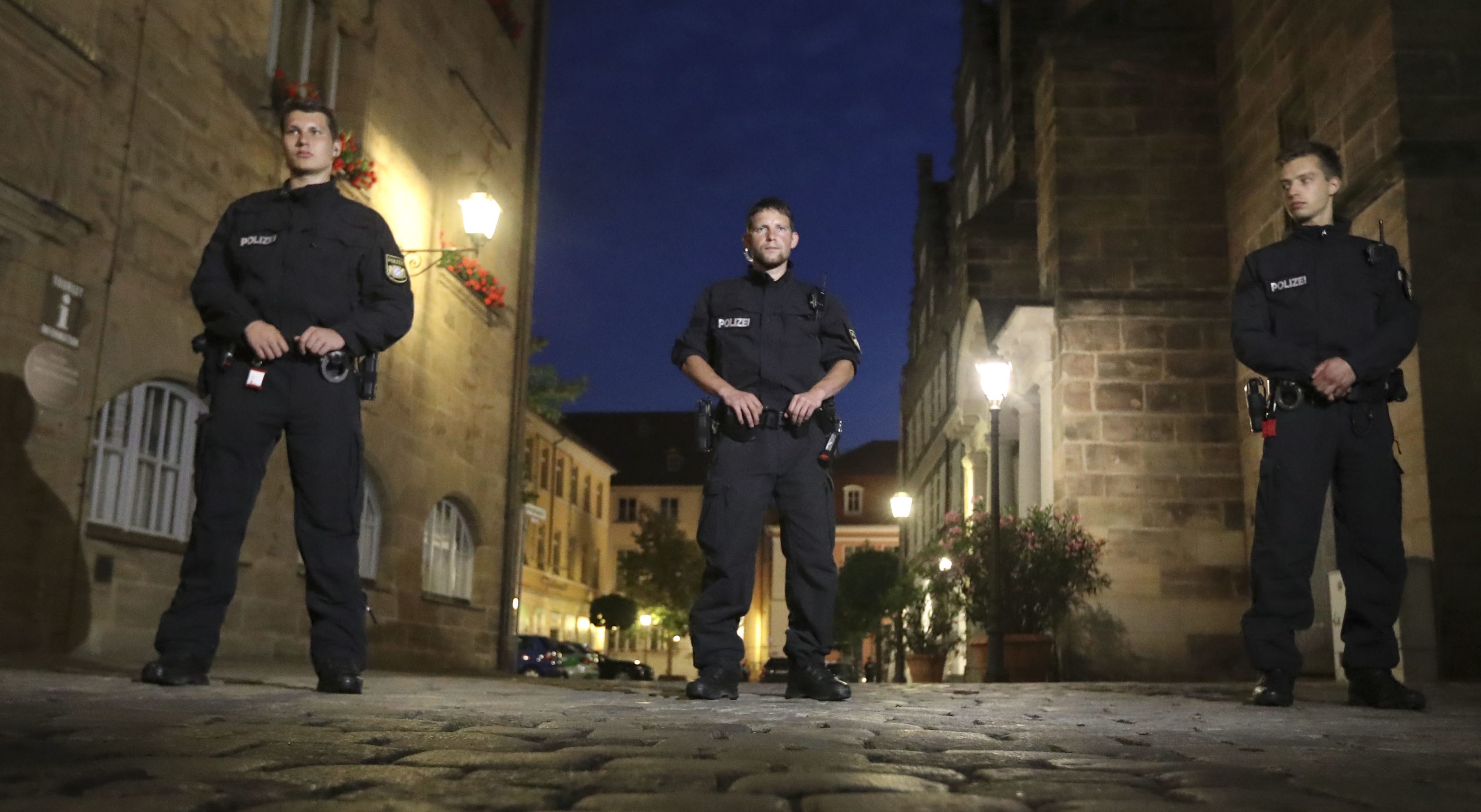 Police secure the area after the bomb attack in Ansbach, Germany.