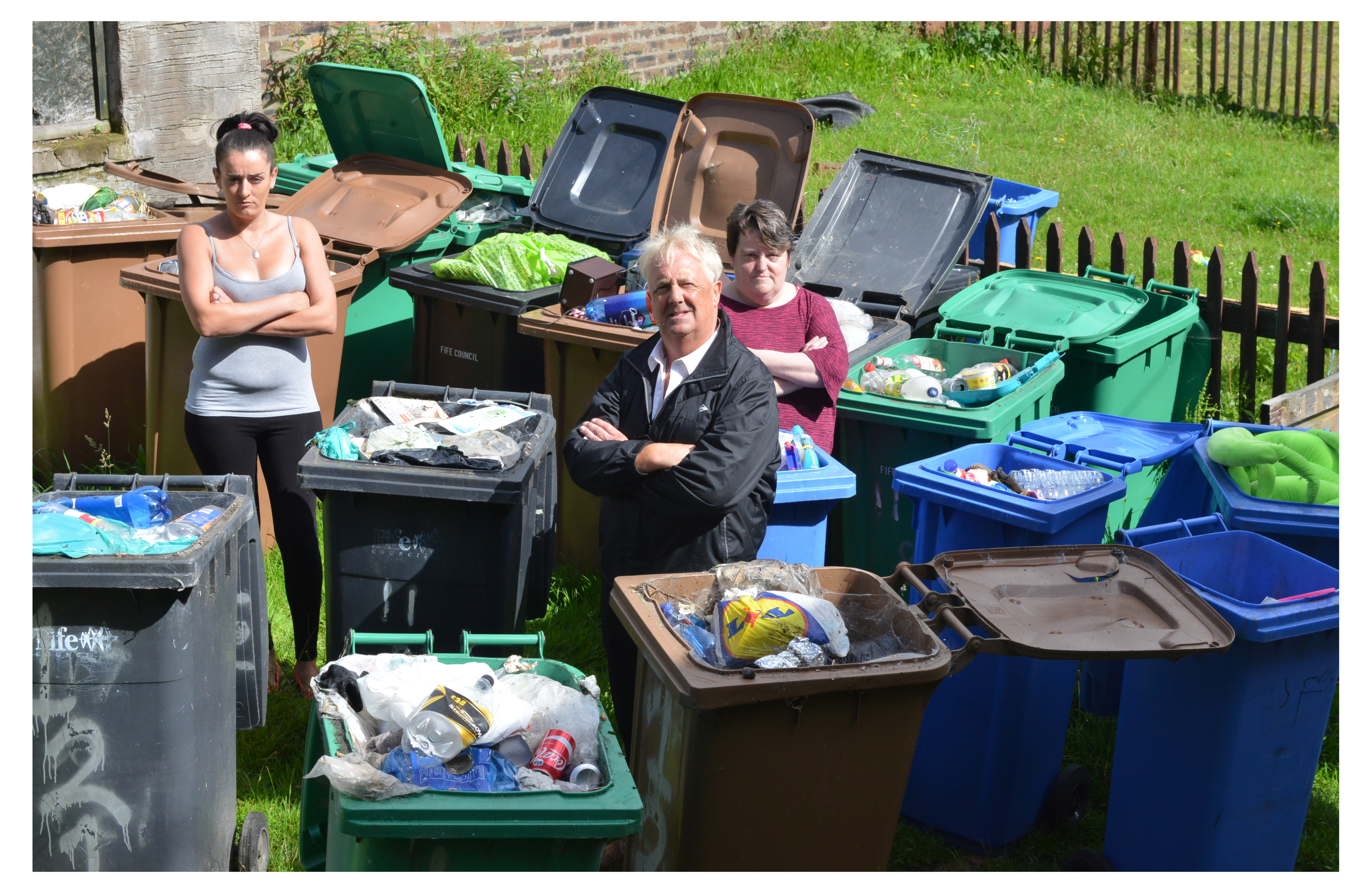 Mr O'Brien and local residents Patricia Kinloch (left) and Michelle Scrase are unhappy with the bins