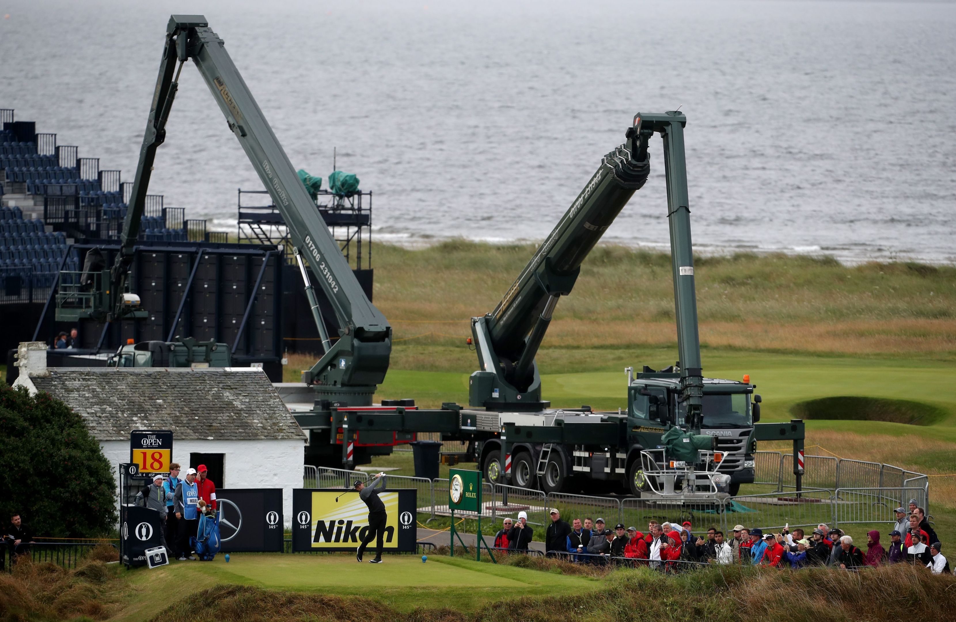 Rory McIlroy tees off the 18th during the final practice day at Royal Troon.