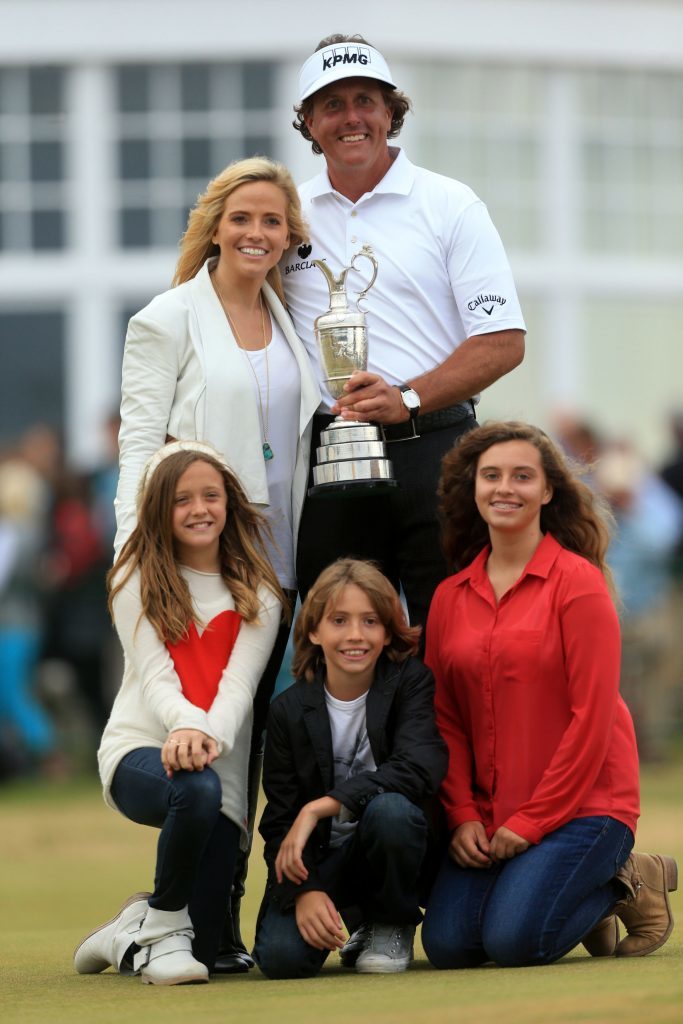 USA's Phil Mickelson celebrates with the Claret Jug and his family after winning the 2013 Open Championship at Muirfield Golf Club.