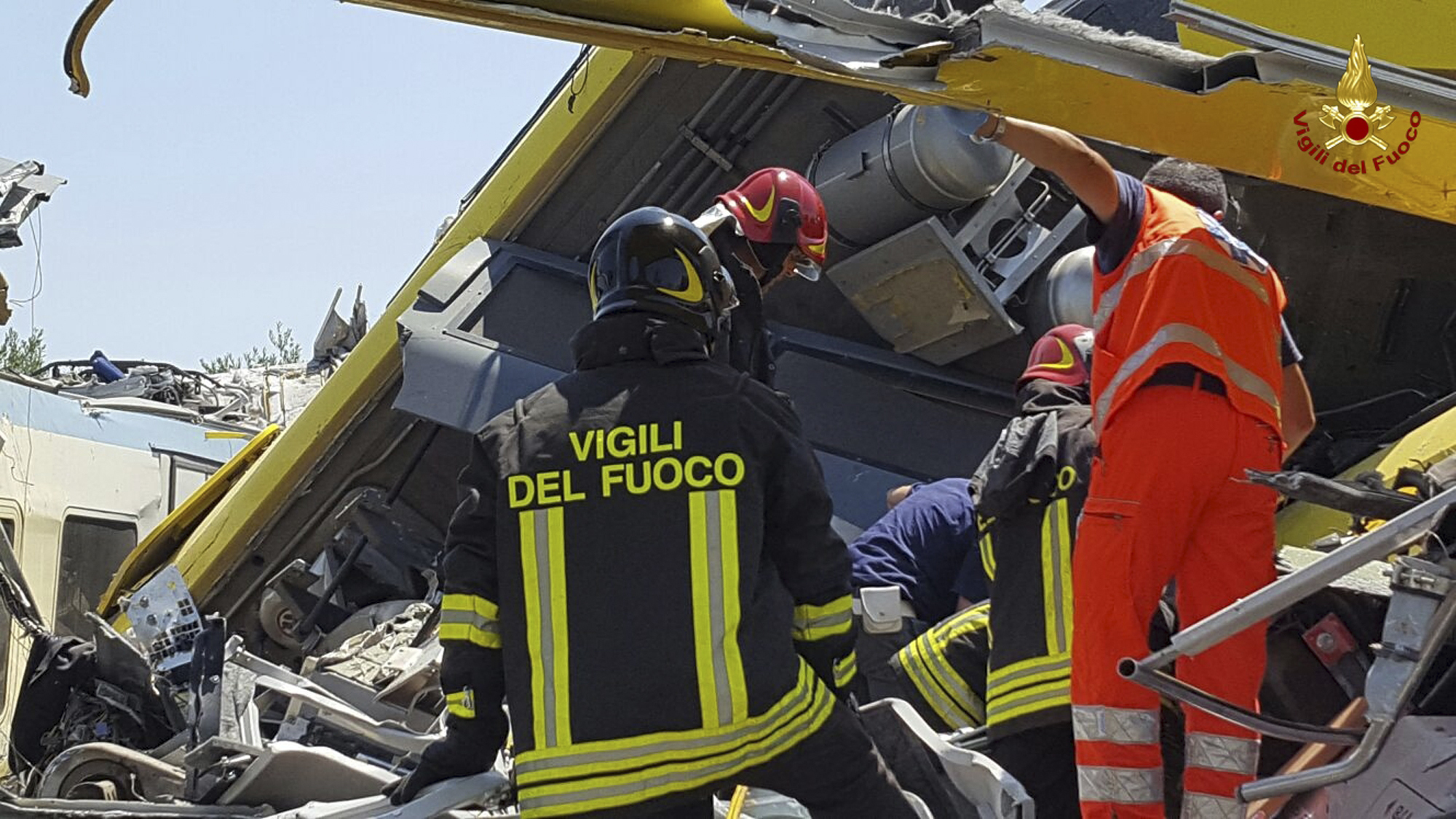 Italian firefighters  inspect the wreckage.