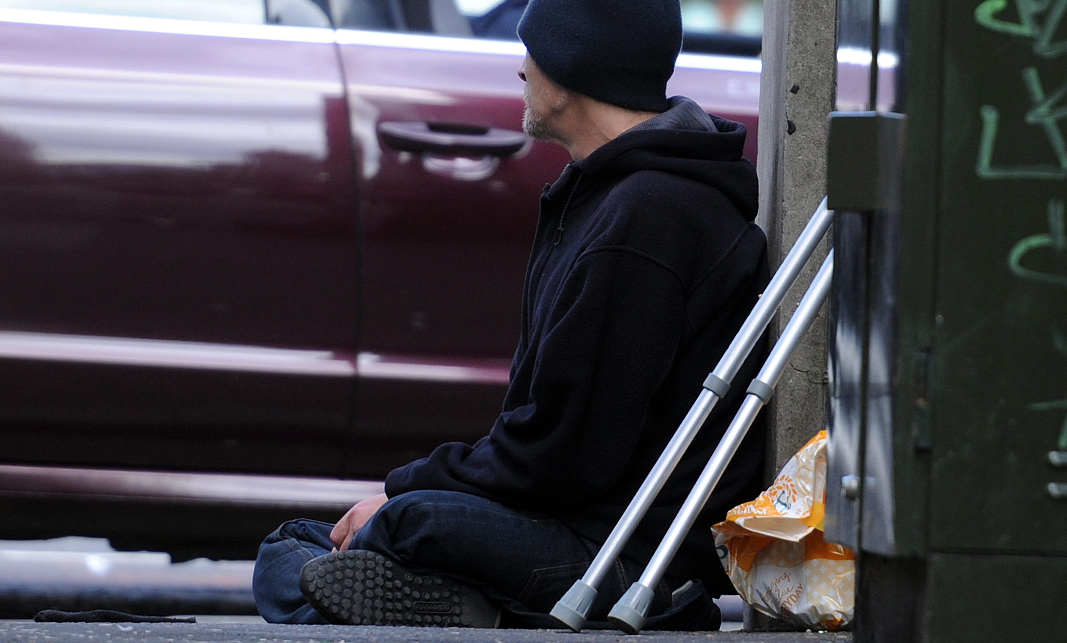 A beggar on Horners Lane, South Street, Perth.