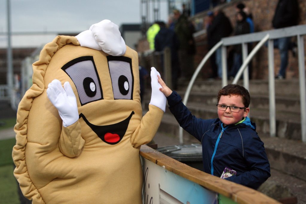 Baxter the Bridie high-fives a young Forfar fan at Station Park. 