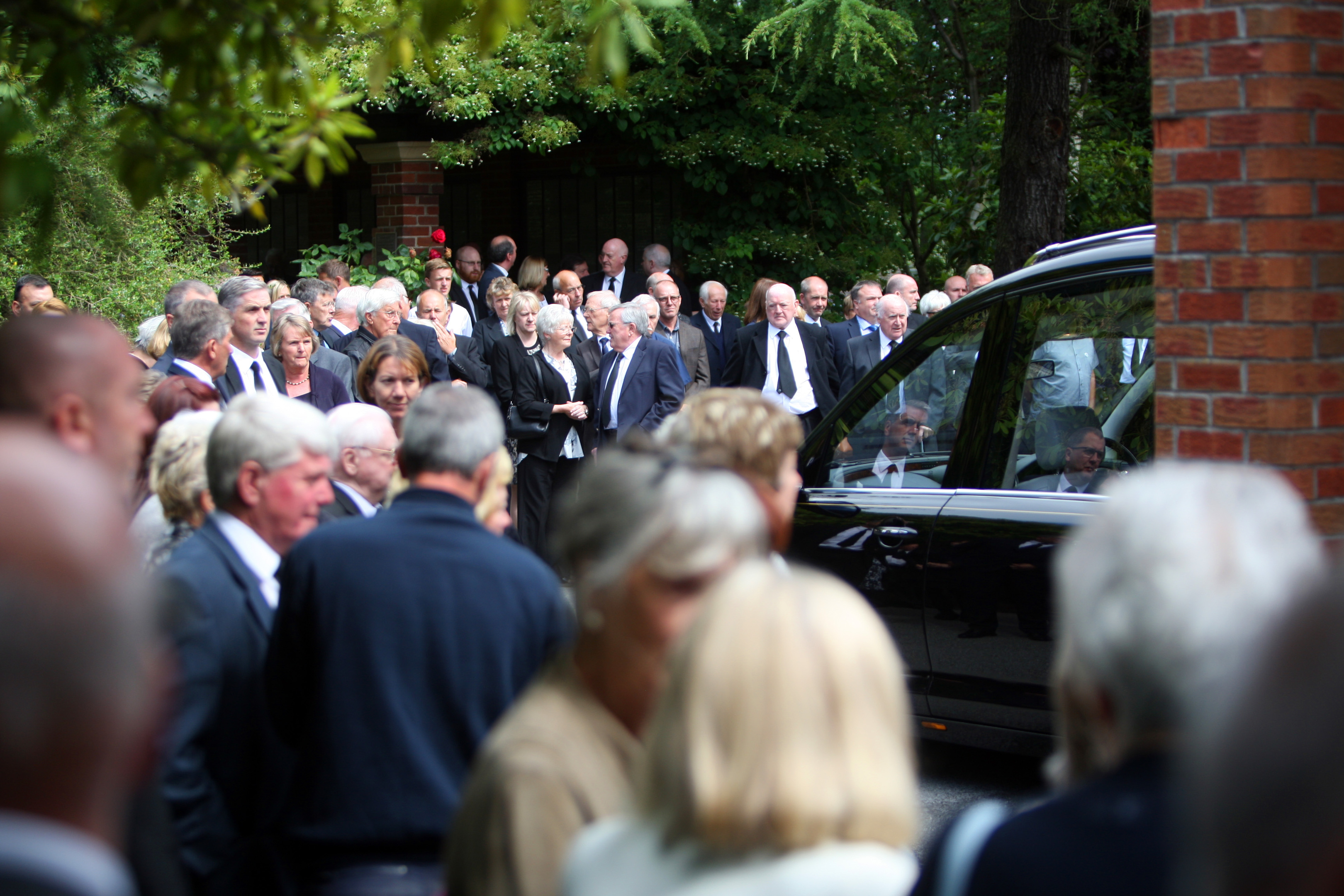 Hundreds of mourners gathered to pay their respects.
