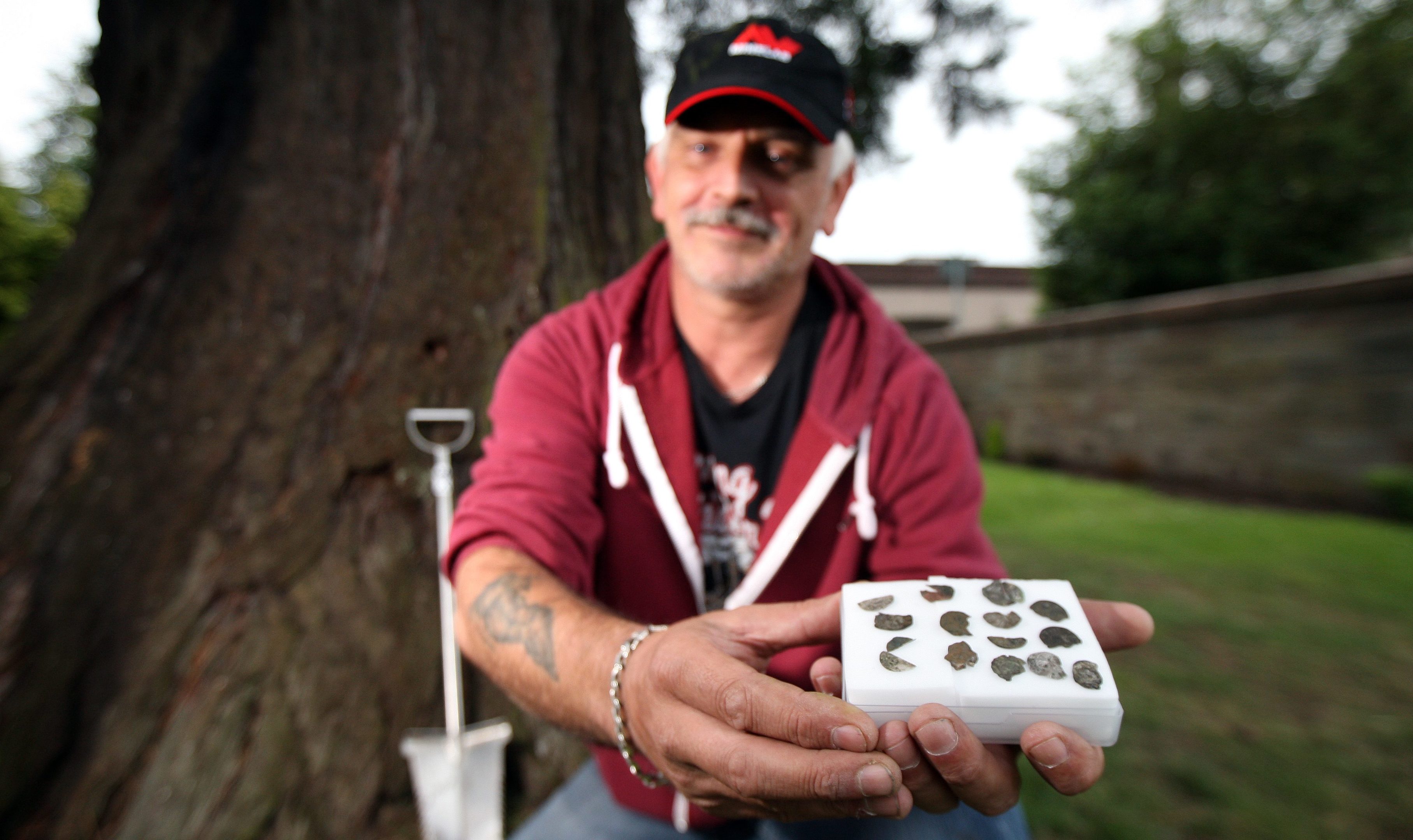 Ken Samson with his hoard of old coins.