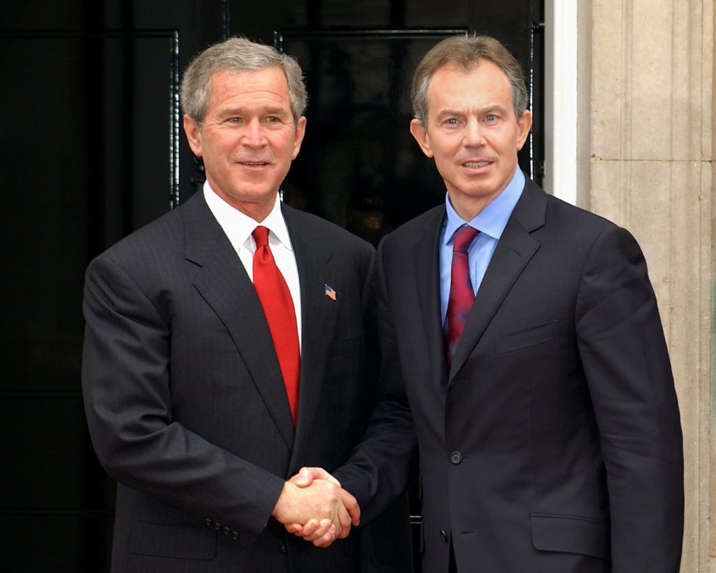 Tony Blair (right) alongside former US President George Bush. 