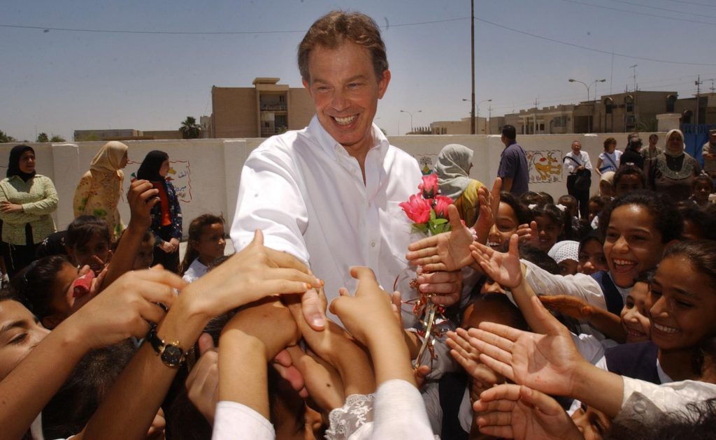 File photo dated 29/05/03 of former Prime Minister Tony Blair with school children in Basra, Iraq. PRESS ASSOCIATION Photo. Issue date: Tuesday July 5, 2016. See POLITICS Chilcot PA Stories. Photo credit should read: Stefan Rousseau/PA Wire