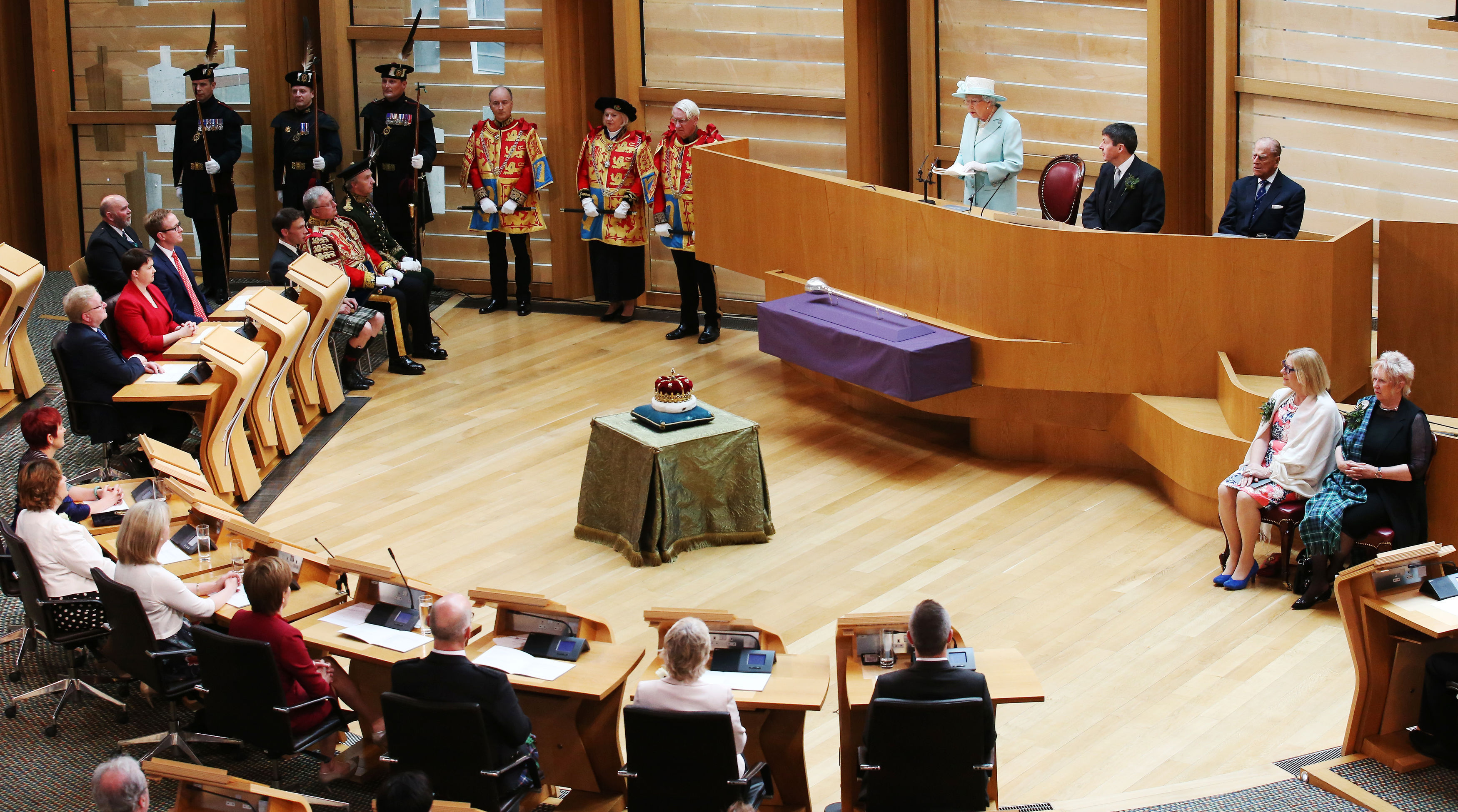 The Queen speaks as Presiding Officer Ken Macintosh and the Duke of Edinburgh listen during the opening of the fifth session of the Scottish Parliament in Edinburgh.