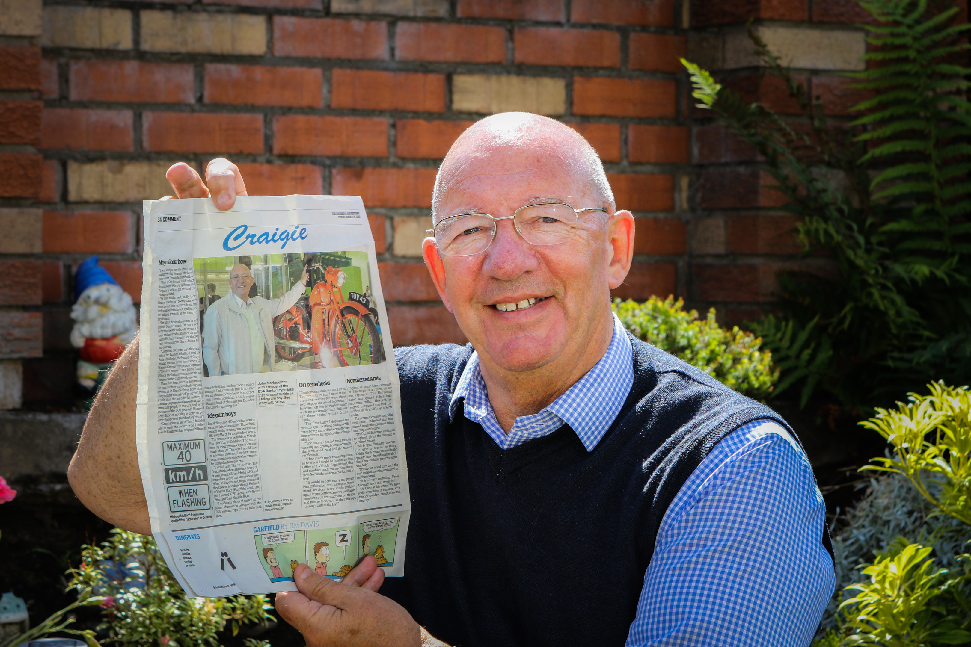 John McNaughton with the article that led to the reunion.