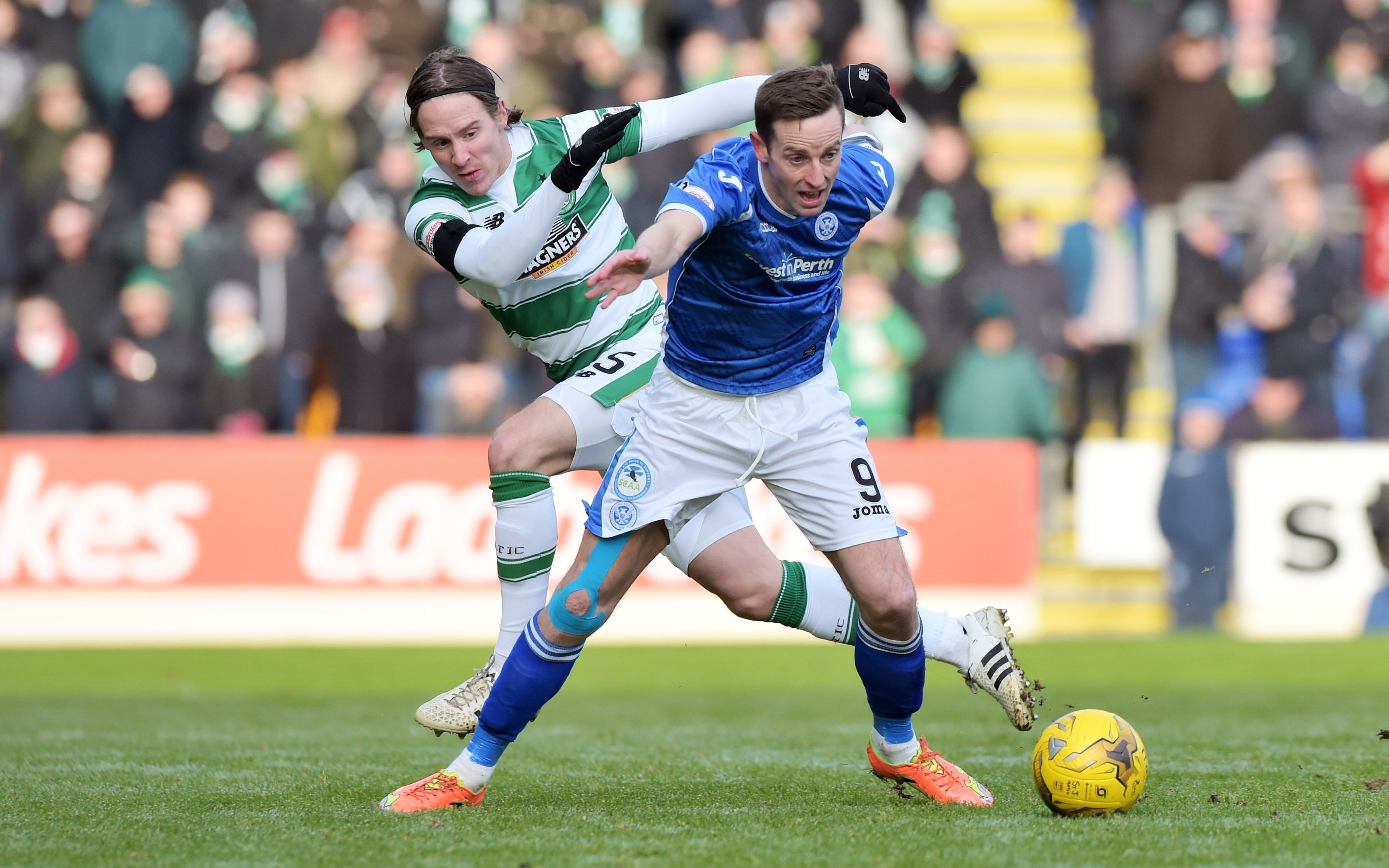 Celtic's Stefan Johansen (left) battles with St. Johnstone’s Steven MacLean during the match in December.