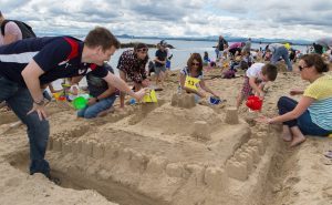  Families build sandcastles before time runs out and the tide comes in at Aberdour Festival