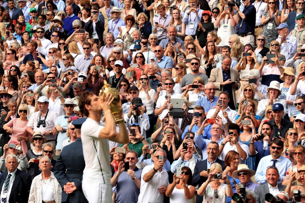 A champion again — Andy Murray gets reacquainted with the Wilmbledon trophy.