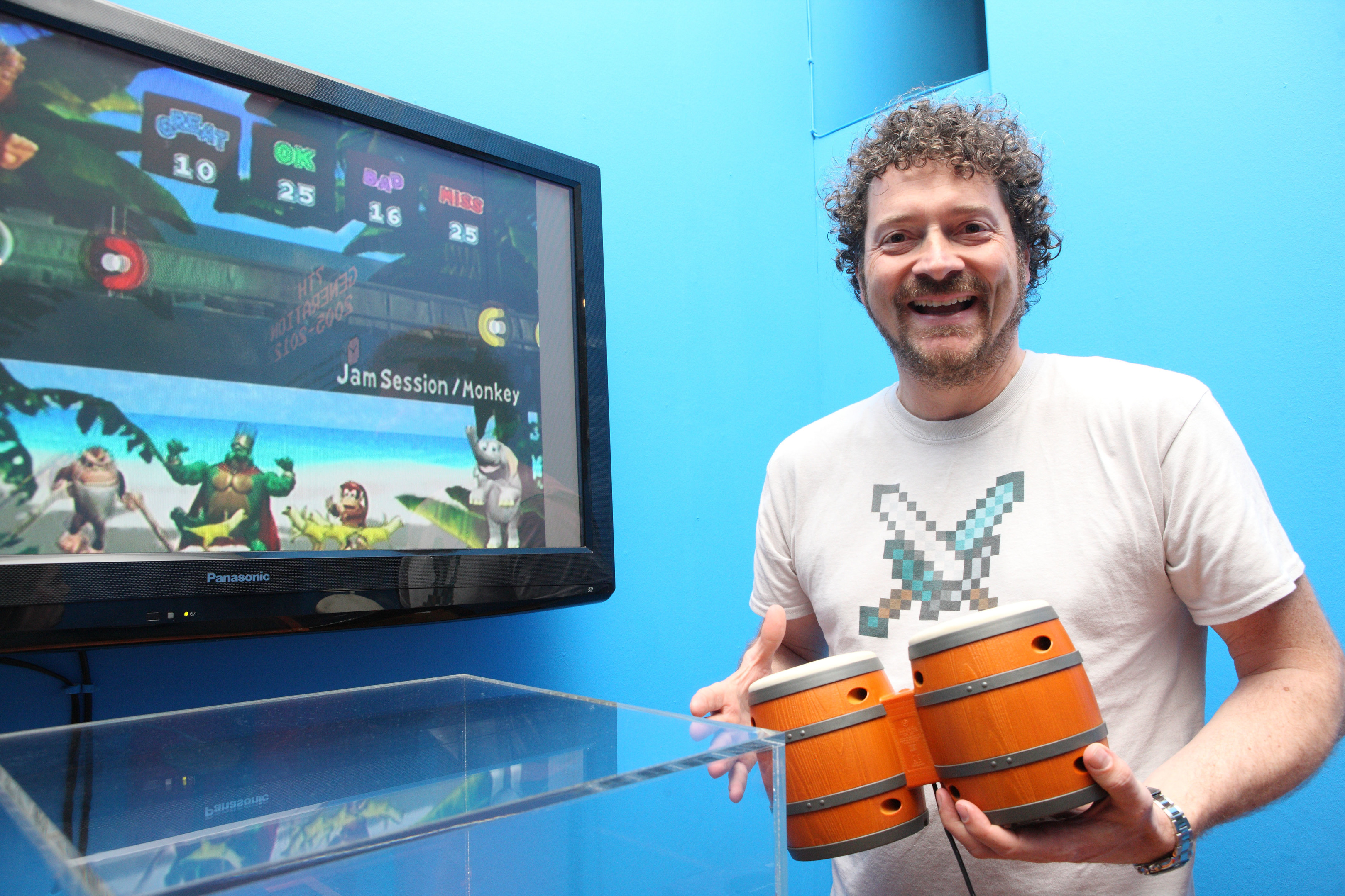 Chris van der Kuyl plays a video game at Perth Museum