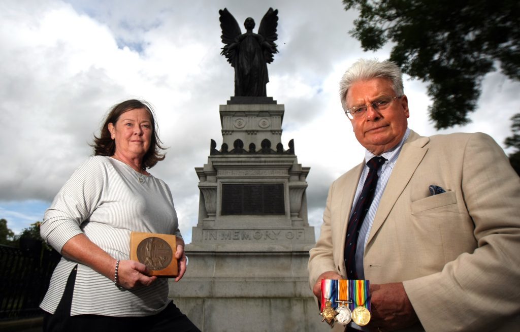 Gilli and Bill Pagan with George Hair Pagan's Dead Man's Penny and his medals in front of Cupar War Memorial