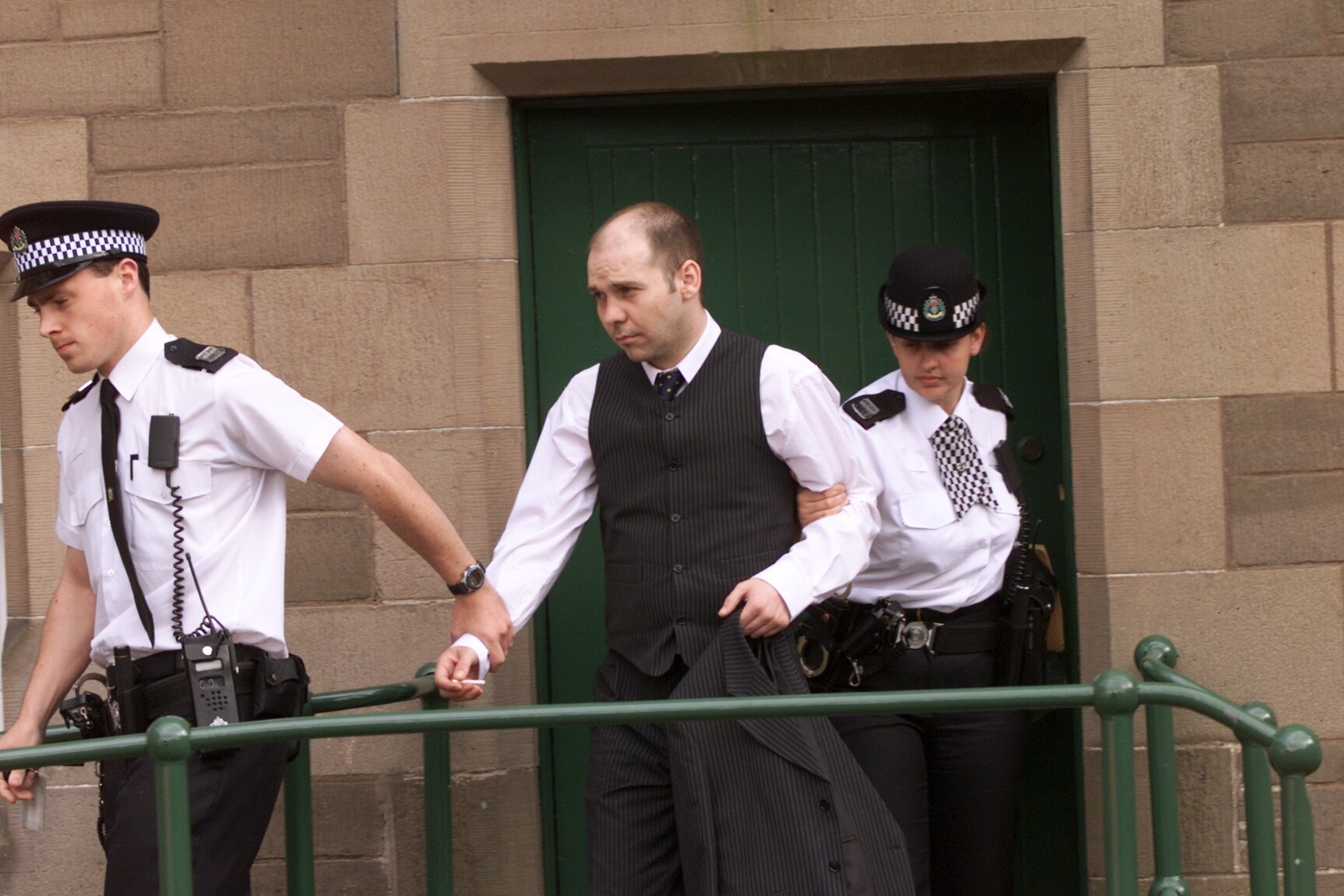 David Roache being taken from Forfar Court to begin his sentence for murder in 2002.