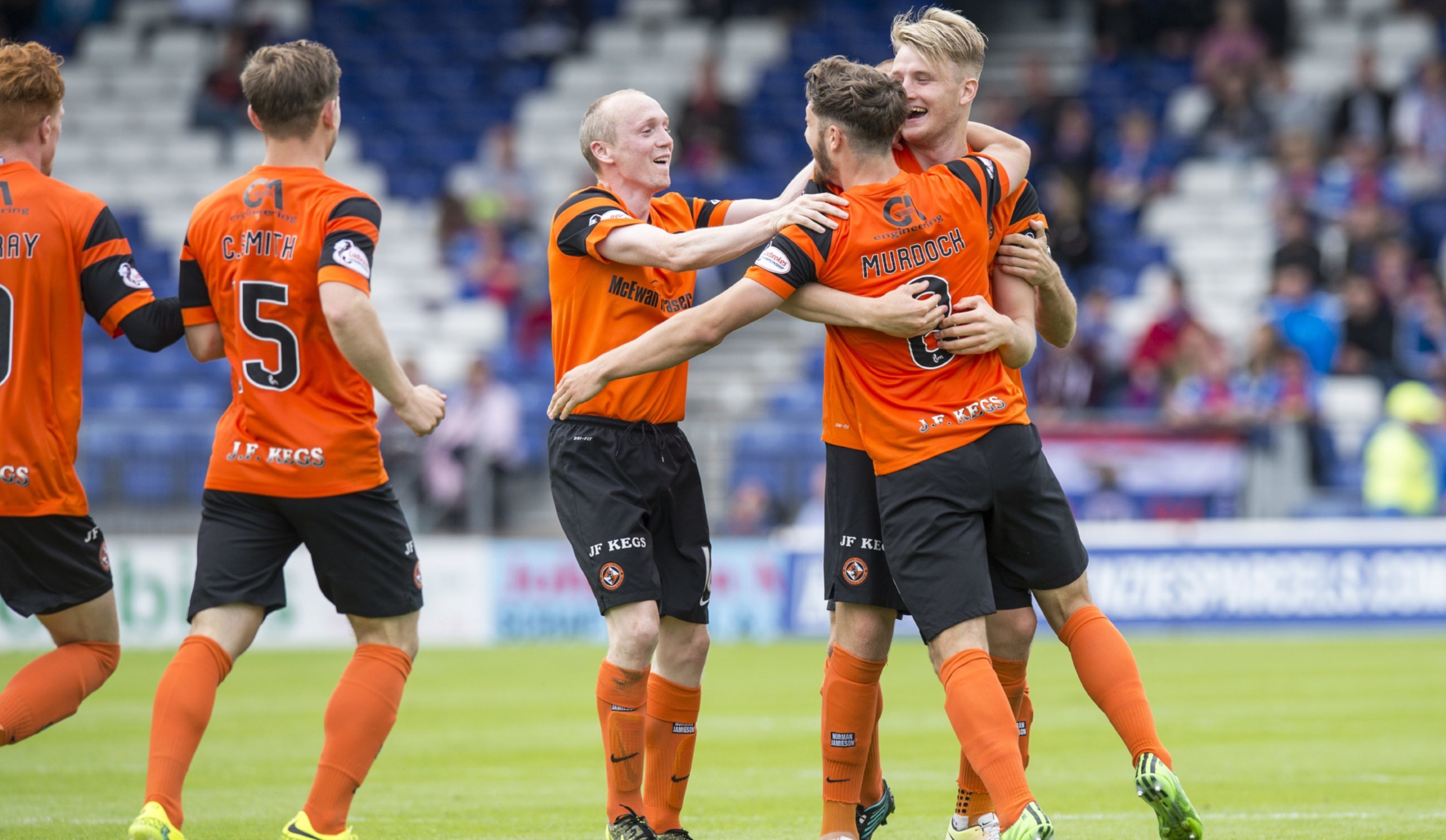 United's players celebrate Stewart Murdoch's goal against Inverness.