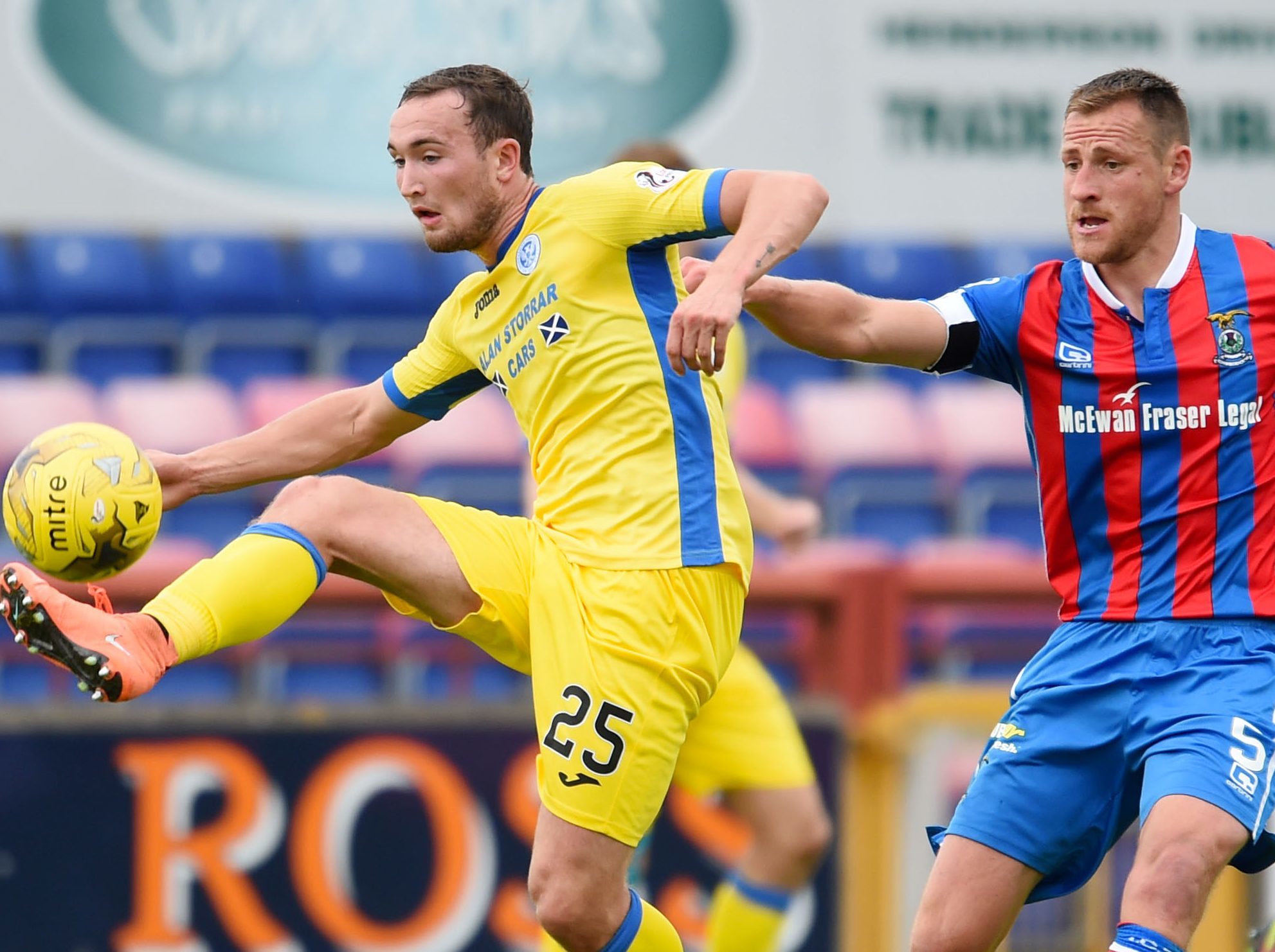 Chris Kane battles with Gary Warren.