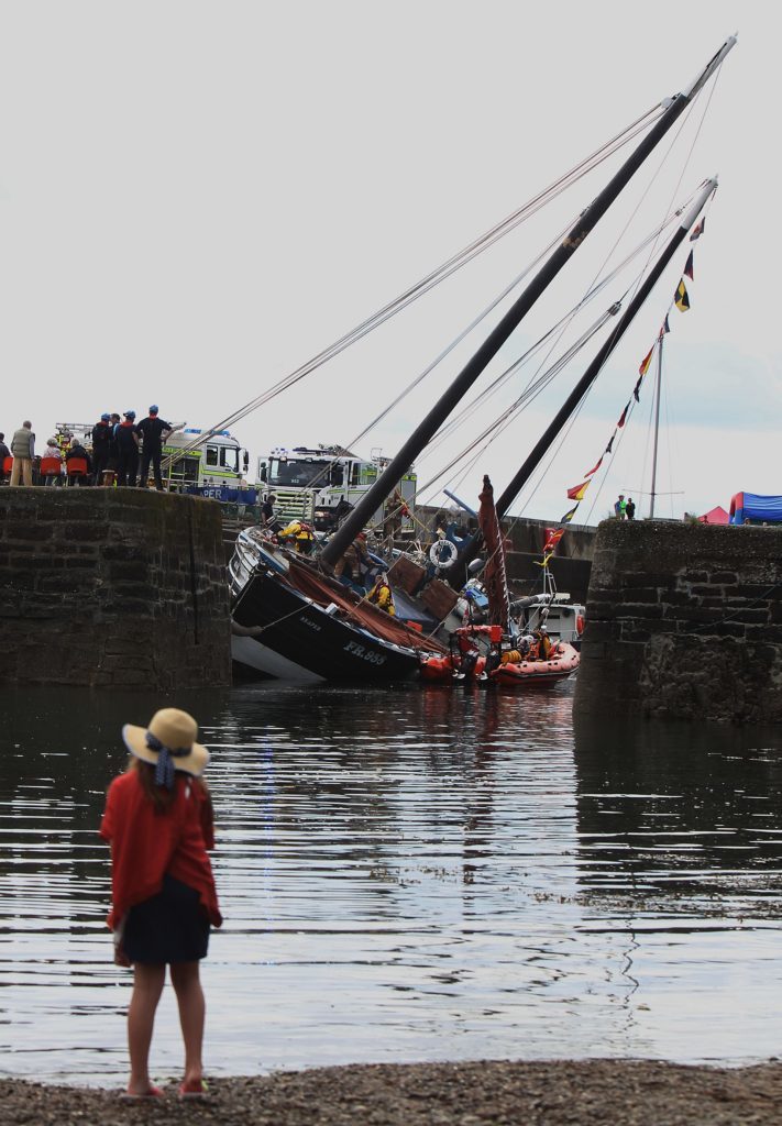 The famous Reaper keels over in a gust of wind at Johnhaven harbour