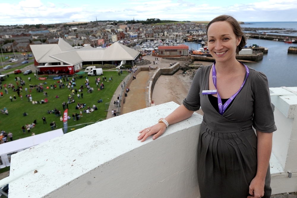 Claire Wallace of the Signal Tower Museum looks out on the Beacon Green during the festivities.