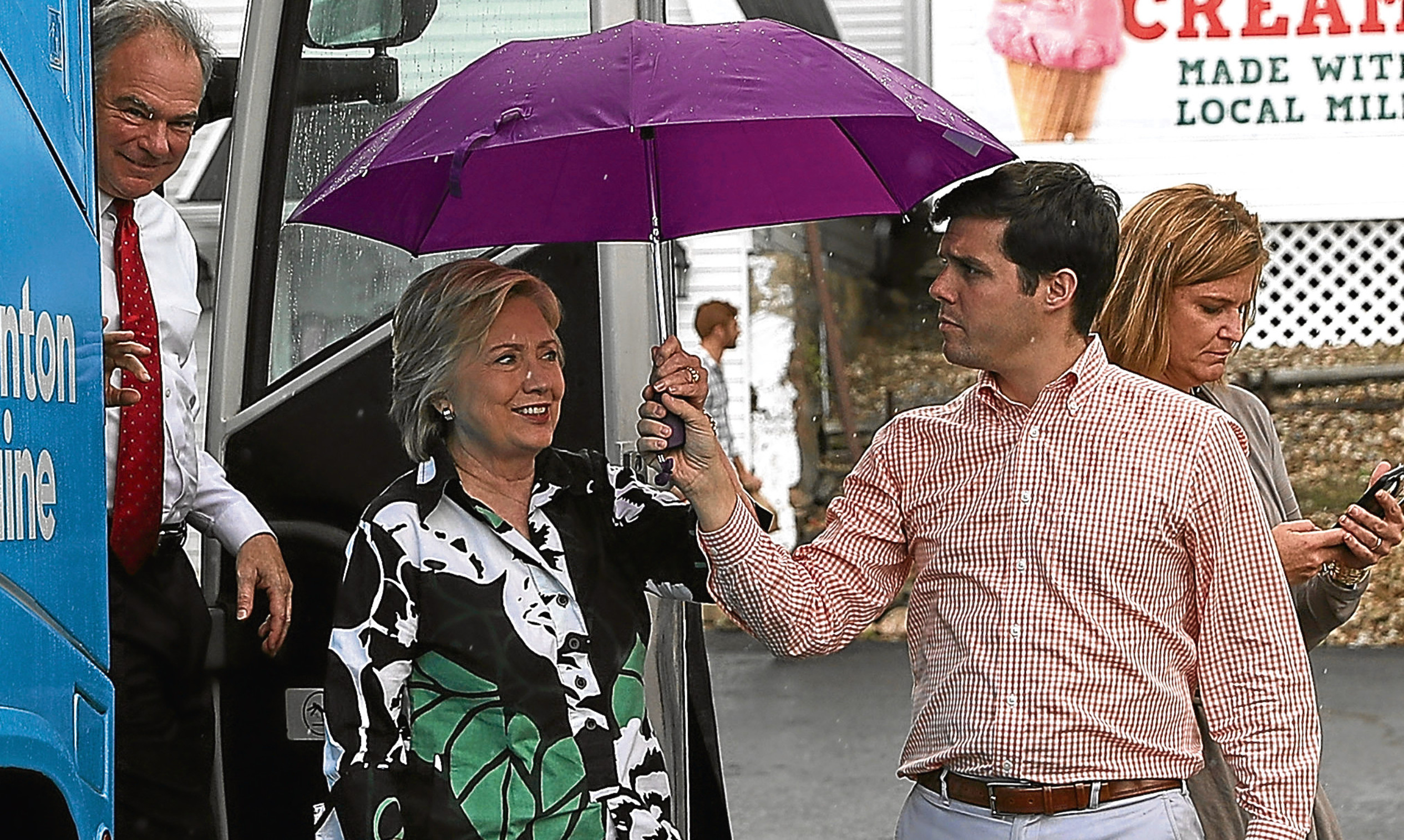 Hillary Clinton's hair is shielded from the elements. Lucy just wishes talk of politicians' hair could be cut from conversations