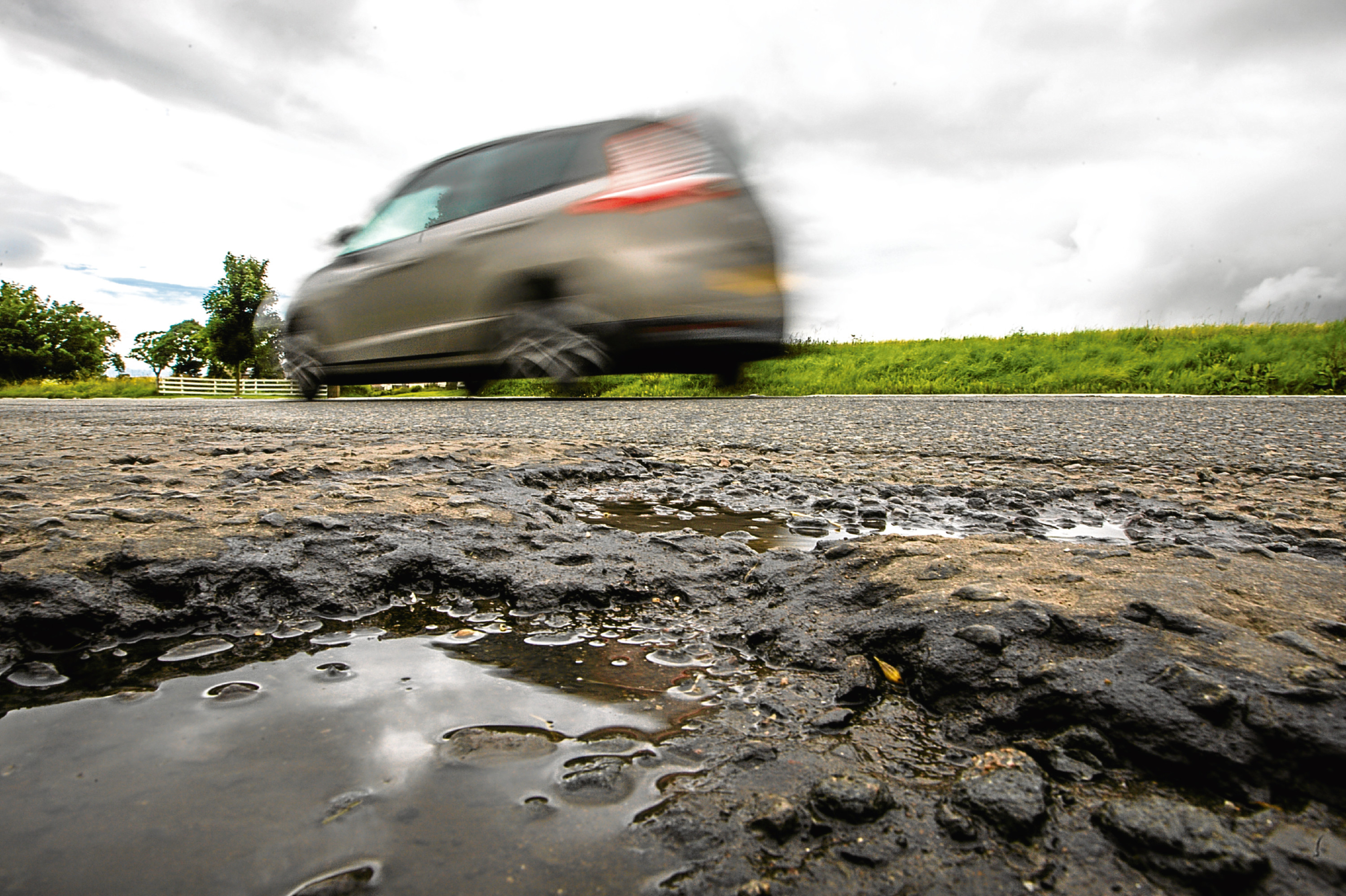 Perthshire road surfaces in poor condition on the A94 North of Scone.