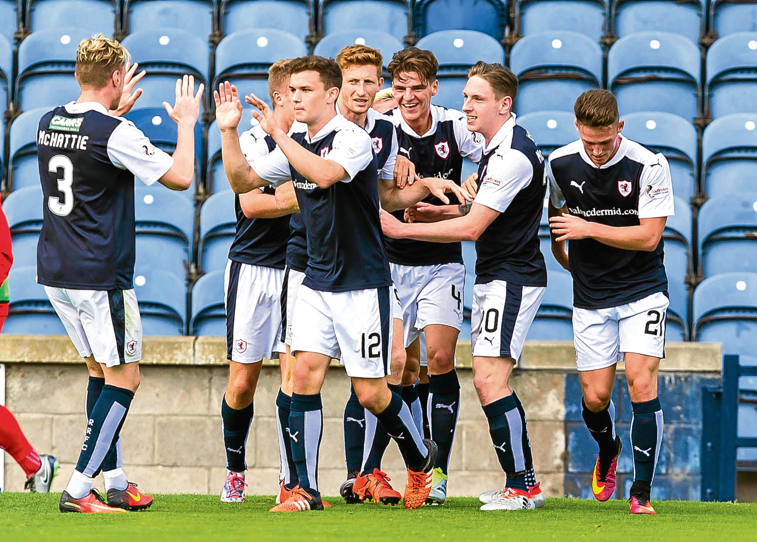 Declan McManus (2nd from right) celebrates his goal with his team-mates.