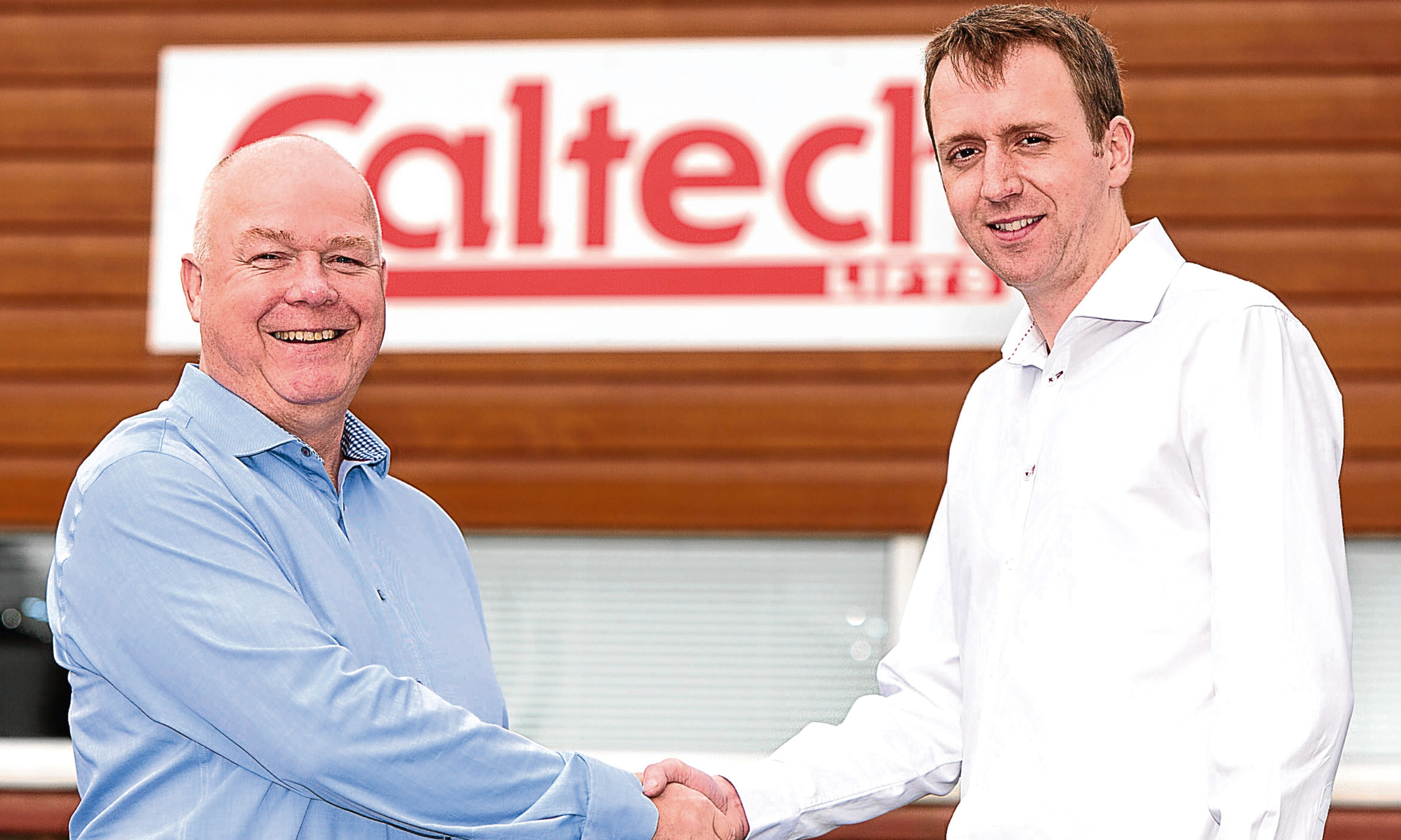 Managing Director Andrew Renwick (right) welcomes Scott Carnegie to the board of Caltech Lifts.